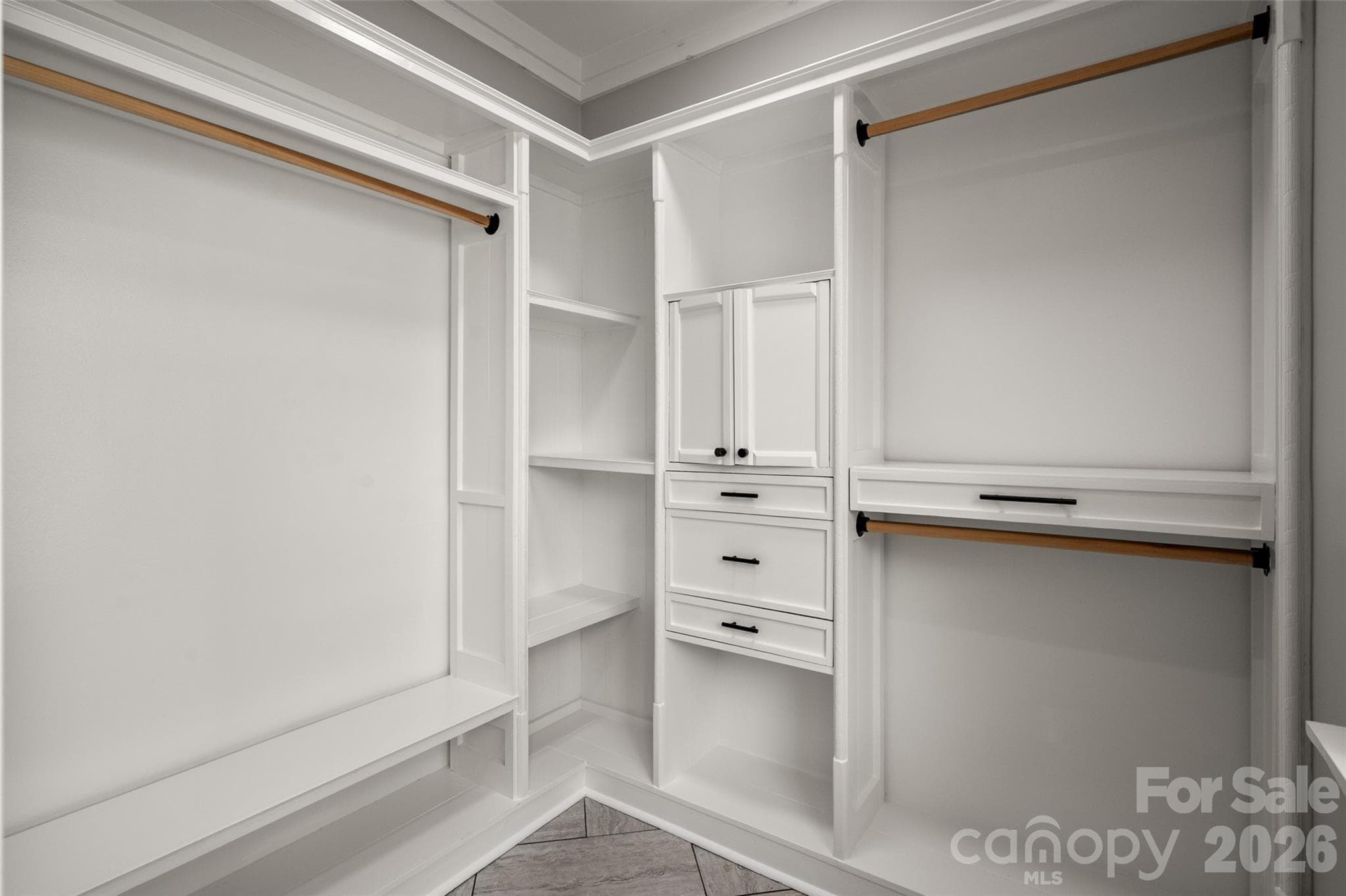Walk-in closet with built-ins in primary bedroom - 174 Tournament Drive SW, Concord