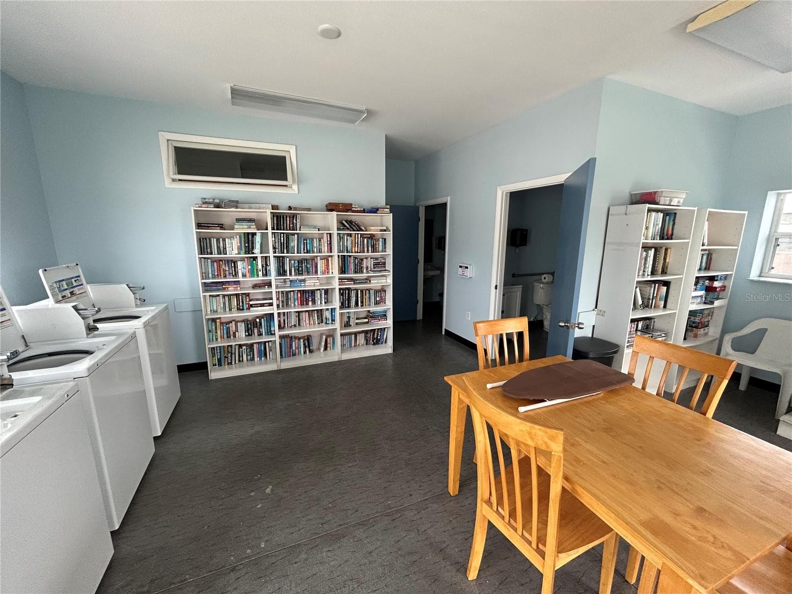 Library in Community laundry room - 12674 SEMINOLE BLVD #S18, LARGO