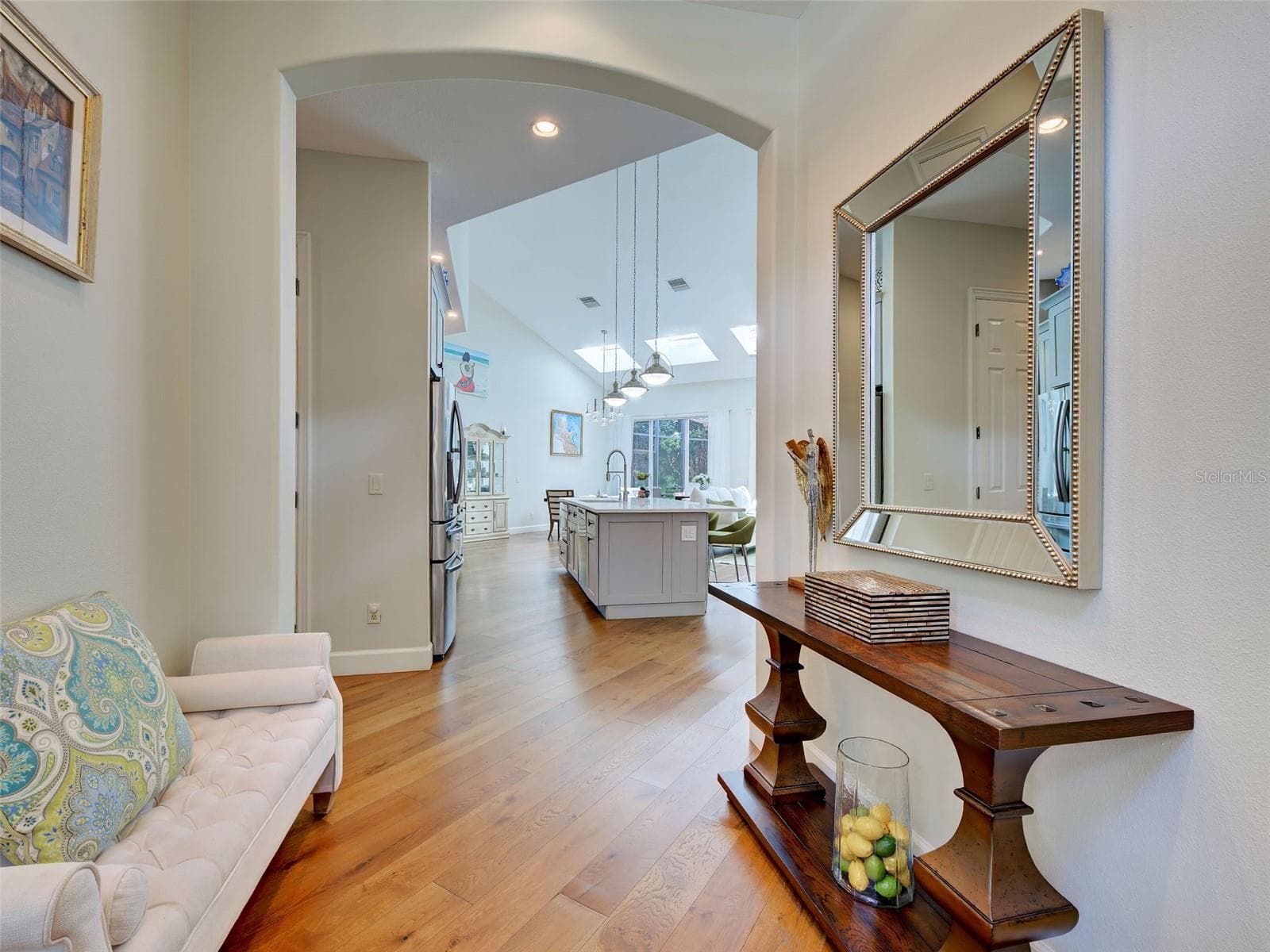 The grand front foyer opens to the kitchen, great room and dining area. - 5026 HANGING MOSS LN, SARASOTA