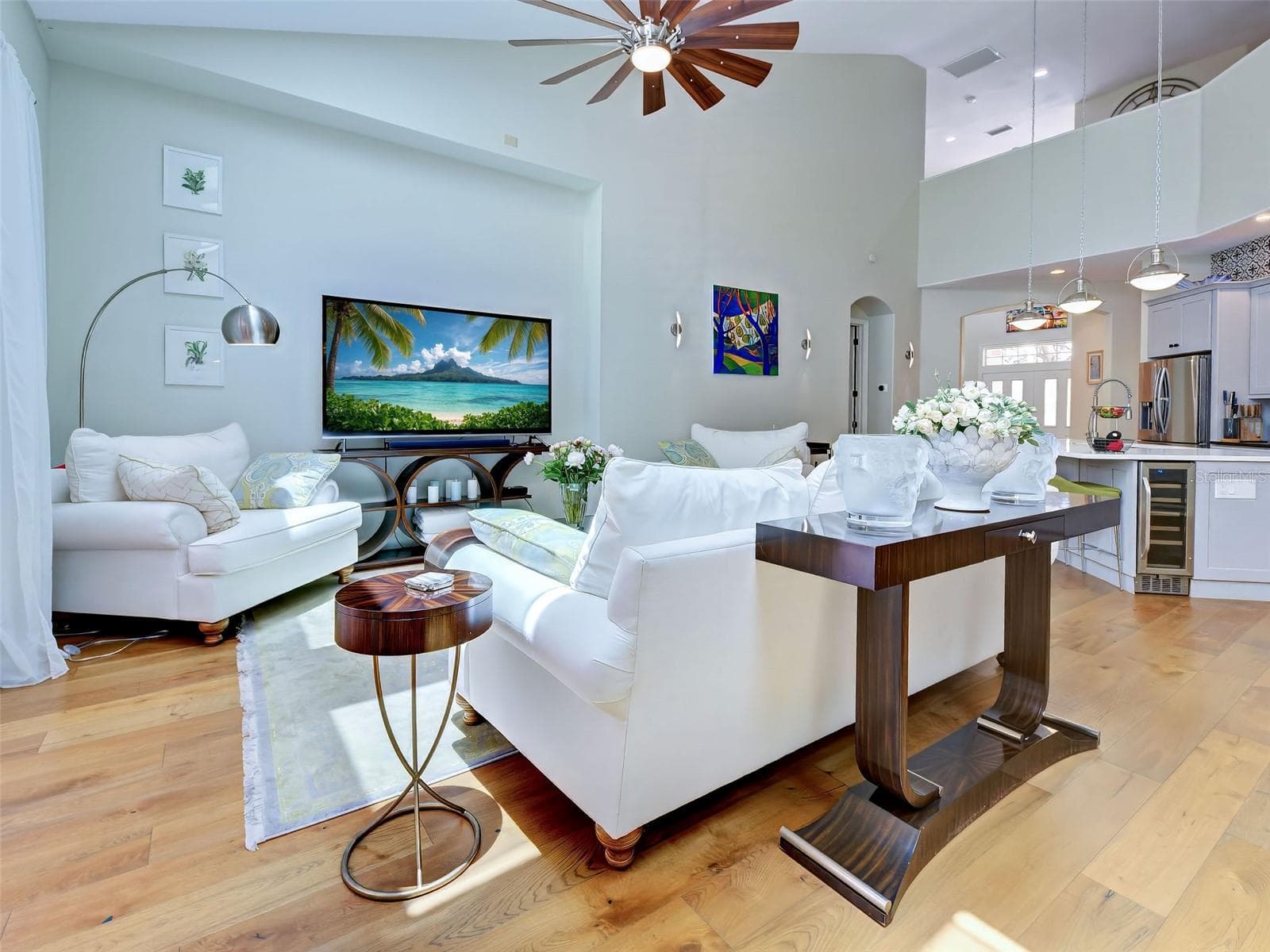 The open floor plan allows easy access to entertain with family and friends and the chef is not isolated in the kitchen. - 5026 HANGING MOSS LN, SARASOTA