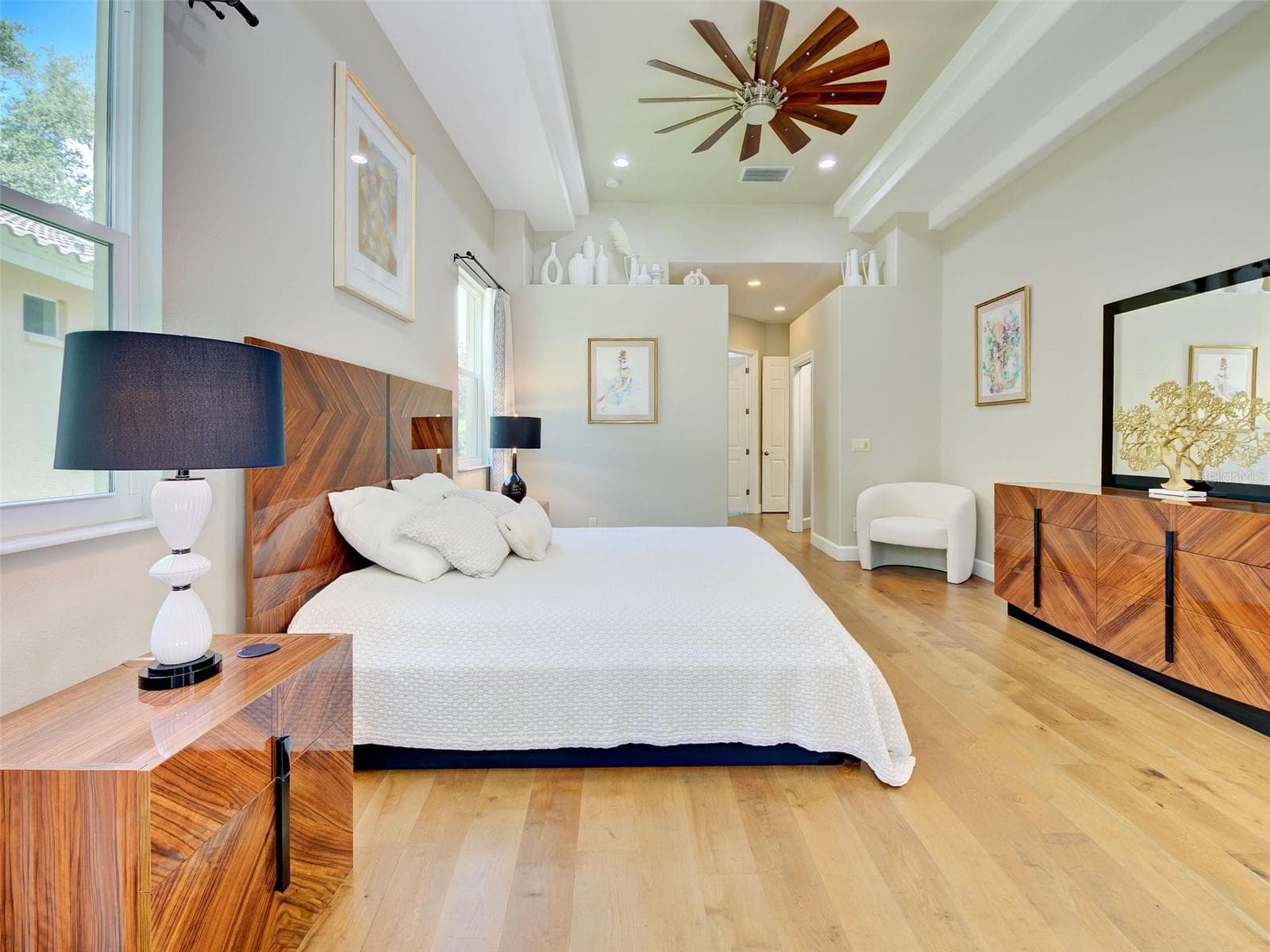 The primary bedroom is accented with a beautiful tray ceiling. - 5026 HANGING MOSS LN, SARASOTA