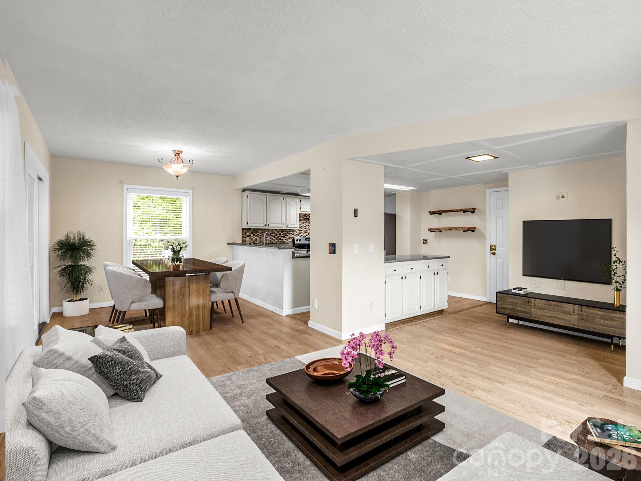 Virtual staging - Open floor plan on main level living, dining and kitchen - 117 Willow Way, Hendersonville