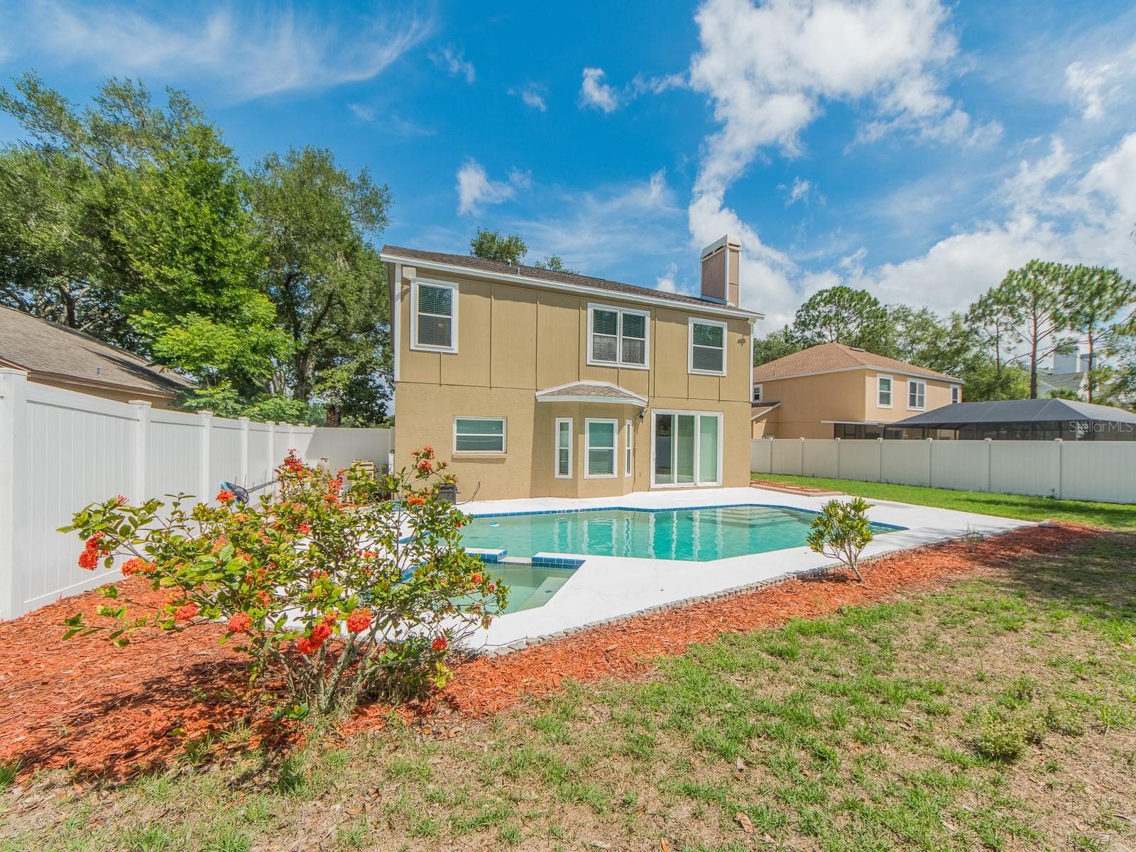 Backyard showing pool & house - 3256 BENTLEY DR, PALM HARBOR
