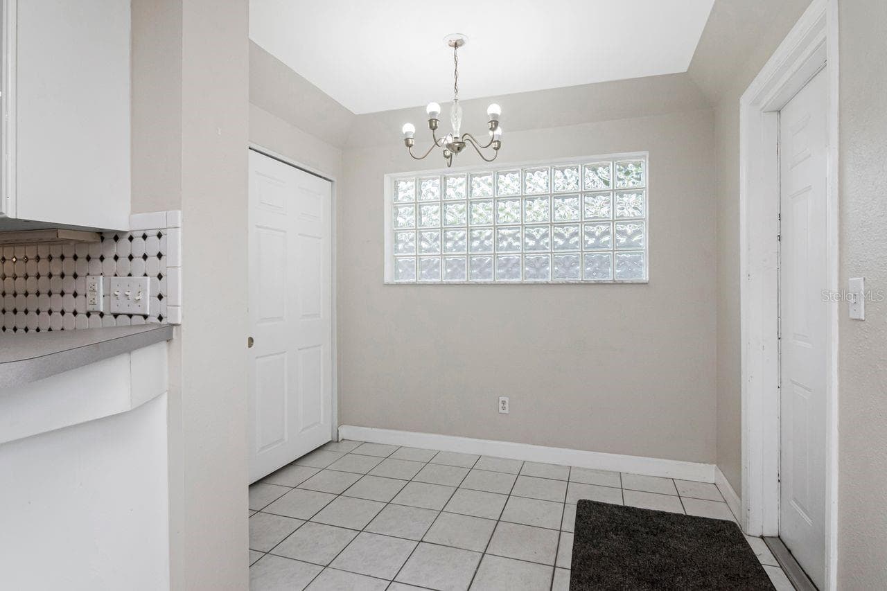 IN LAW SUITE PRIVATE ENTRANCE AND DOOR TO LAUNDRY ON LEFT - 10532 67TH AVE, SEMINOLE