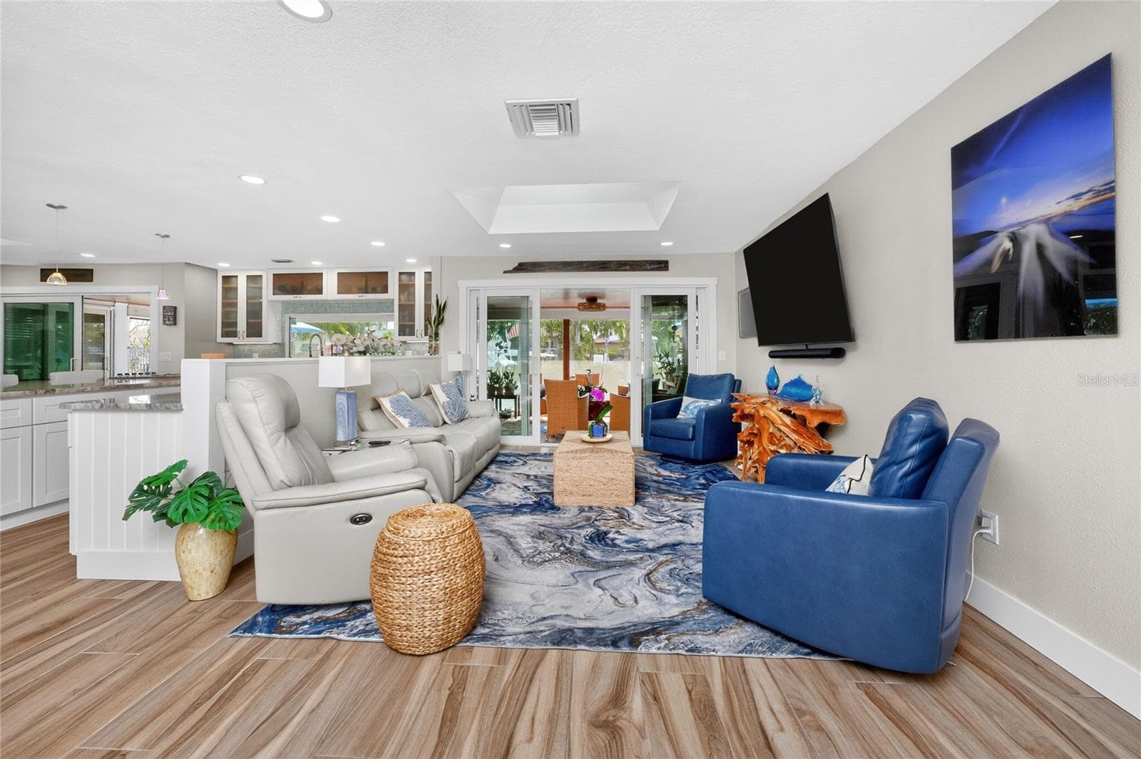 Flowing room to room, wood-plank porcelain tile flooring ties the whole open concept together - A stunning blend of hardwood character and durability. - 80 SABAL DR, PUNTA GORDA