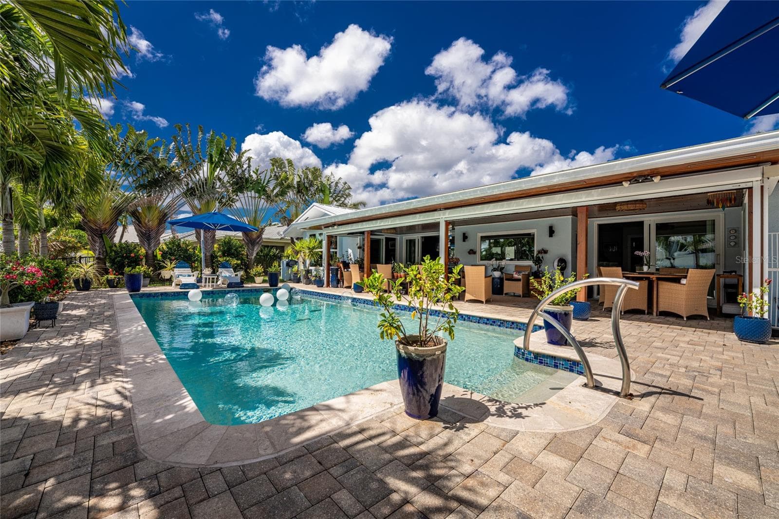 A heated saltwater pool with chiller system — perfect water temperature, all year long. - 80 SABAL DR, PUNTA GORDA