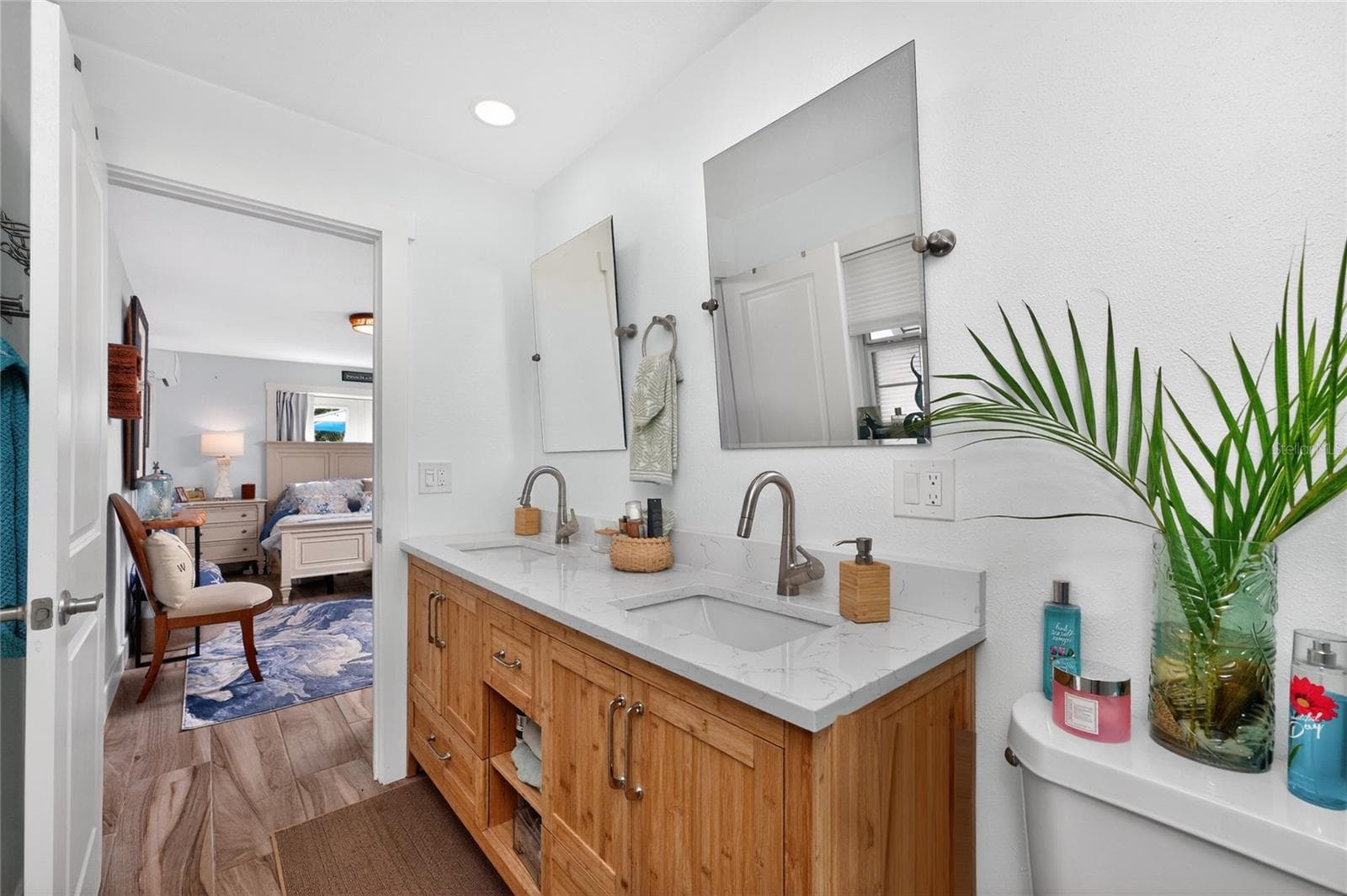 Natural warmth meets modern polish in this redesigned ensuite bath  built for everyday luxury. - 80 SABAL DR, PUNTA GORDA