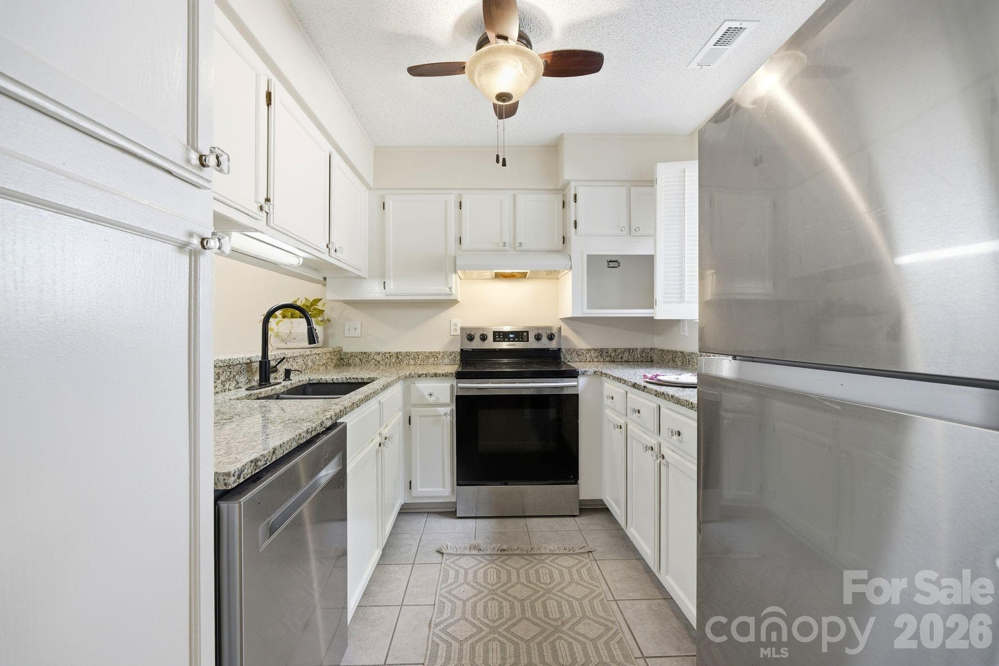 Kitchen area with lots of cabinets, SS appliances, Brand new Dishwasher and Granite Counter tops - Charlotte