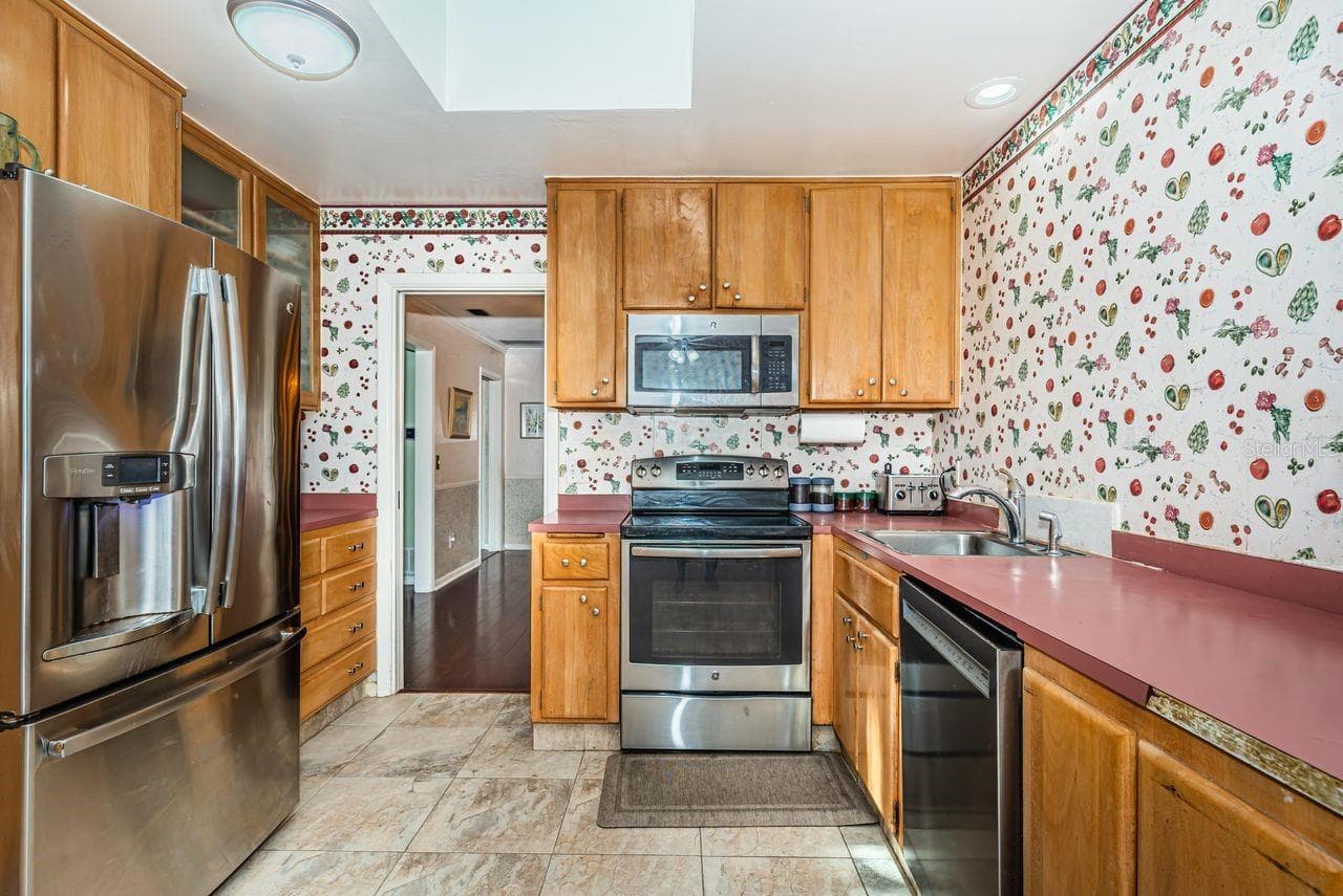 Kitchen with Stainless appliances - 1704 CYPRESS AVE, BELLEAIR