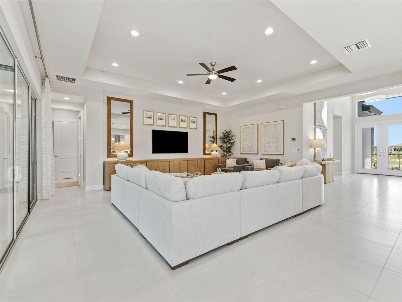 This living room defines perfection, offering a beautiful and inviting space to relax and enjoy. - 3857 CABERNET TER, WESLEY CHAPEL