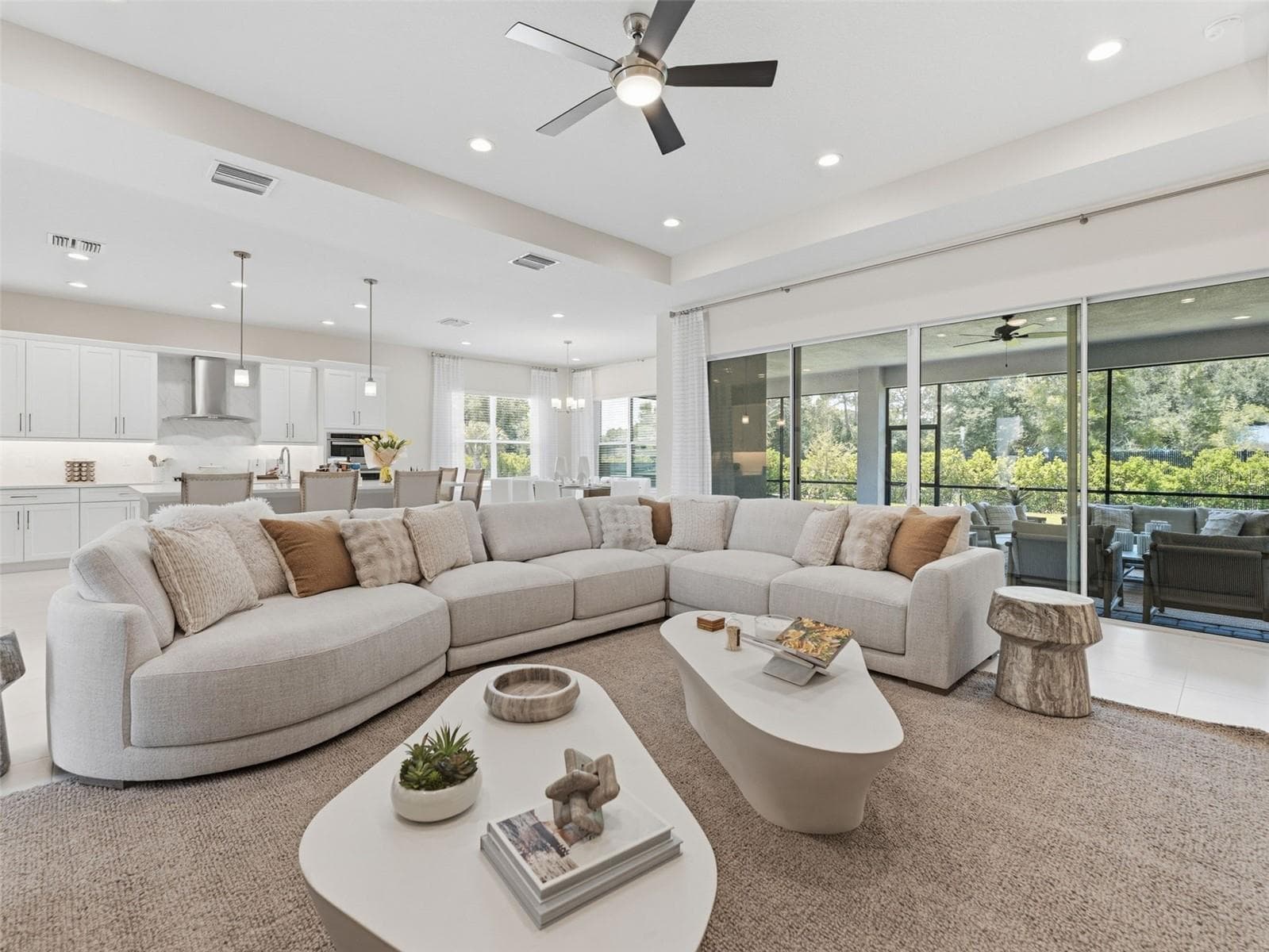 A Cozy Living Space With Stackable Sliding Glass Doors - 3857 CABERNET TER, WESLEY CHAPEL