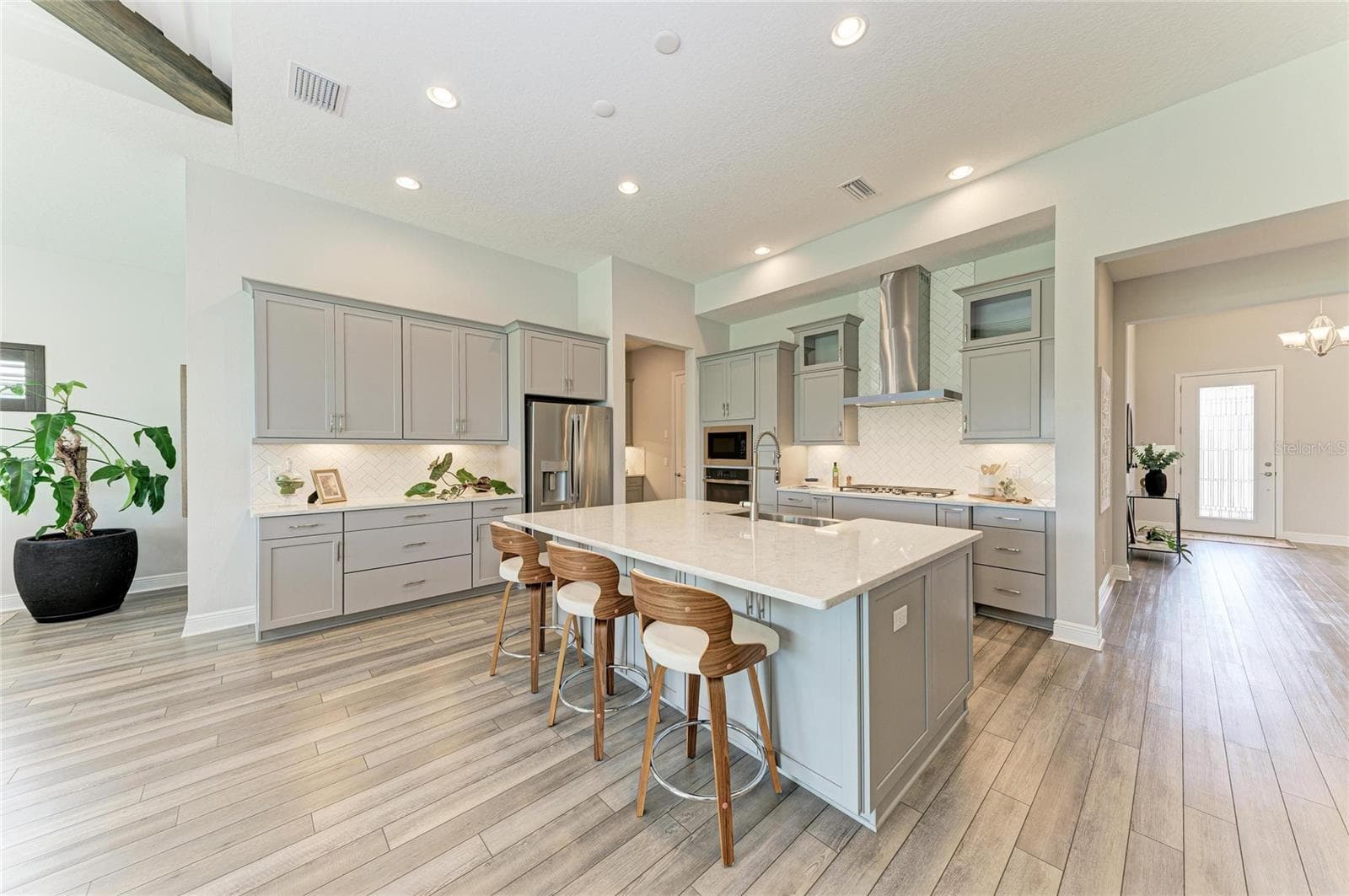 Chef-inspired kitchen featuring GE Profile appliances - 17725 ROOST PL, LAKEWOOD RANCH