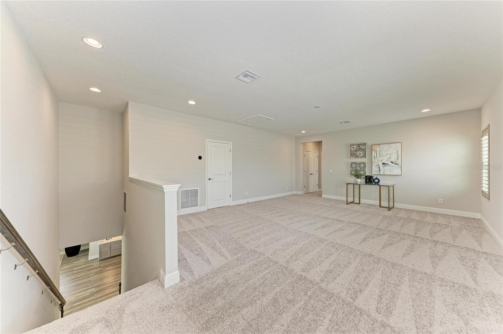Expansive bonus room ideal for a media room, game room, secondary living area, or home gym - 17725 ROOST PL, LAKEWOOD RANCH