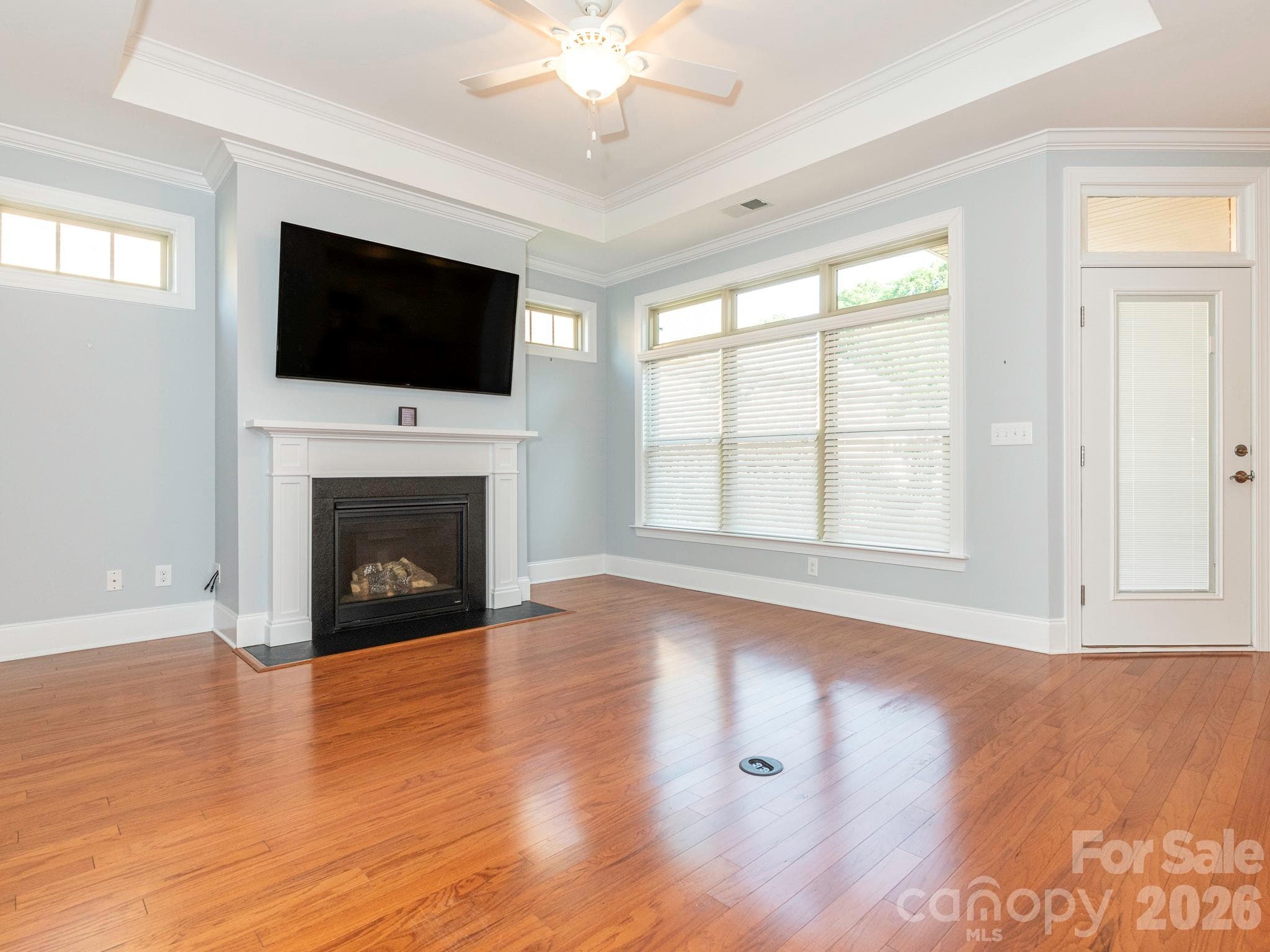 Great room has ceiling fan and fireplace with gas logs. - 4534 Ideal Way, Harrisburg