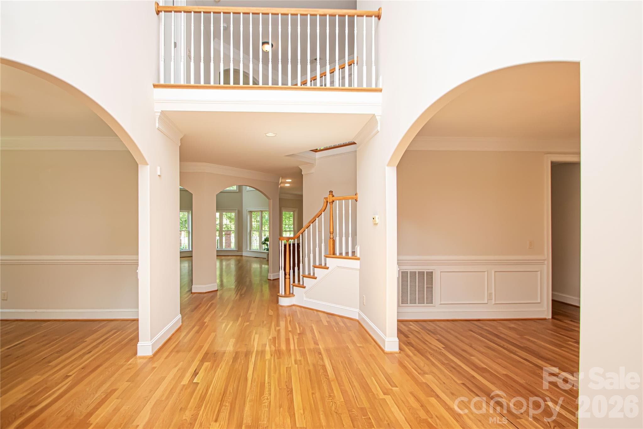 2-story entryway with hardwood floors throughout. - Matthews