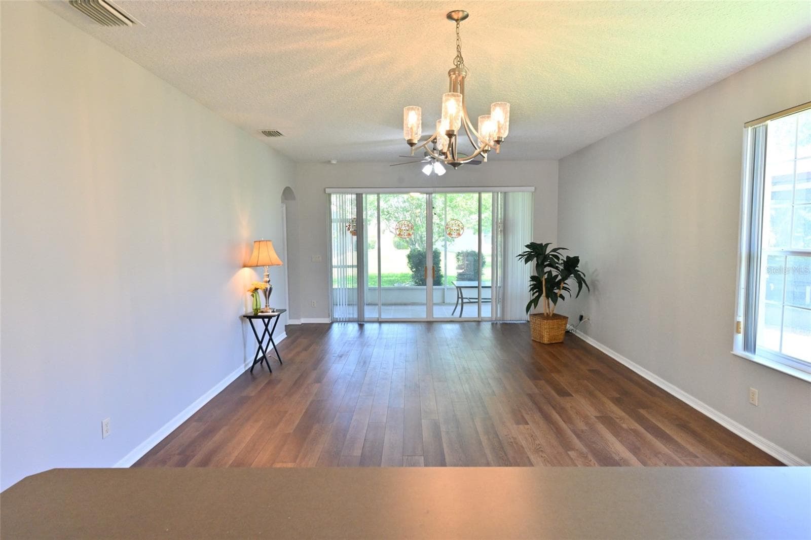 Family room from kitchen . - 27326 ORCHID GLADE ST, LEESBURG