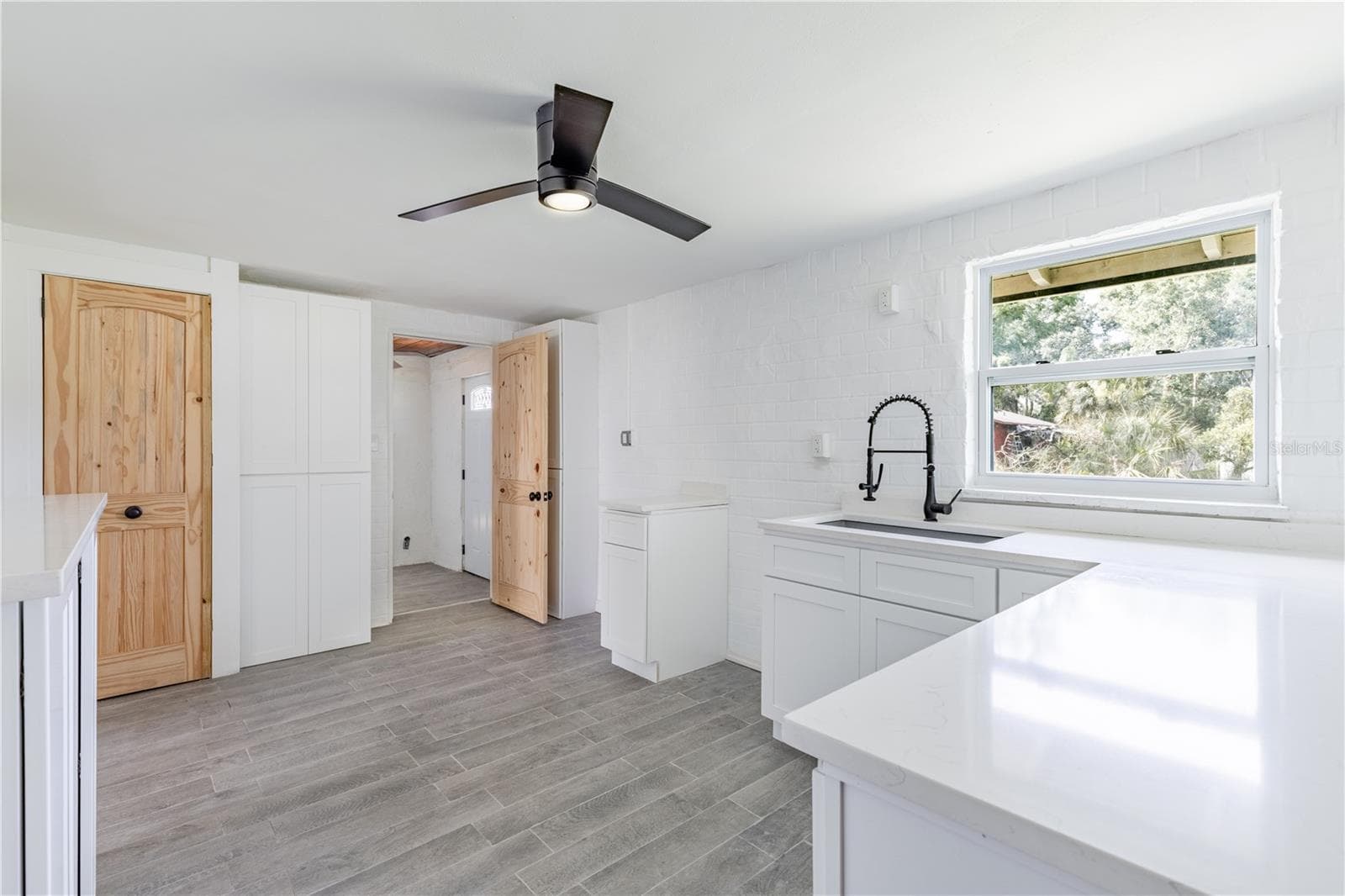 Kitchen with quartz counters and deep sink - 7020 SCOTT AVE, MOUNT DORA