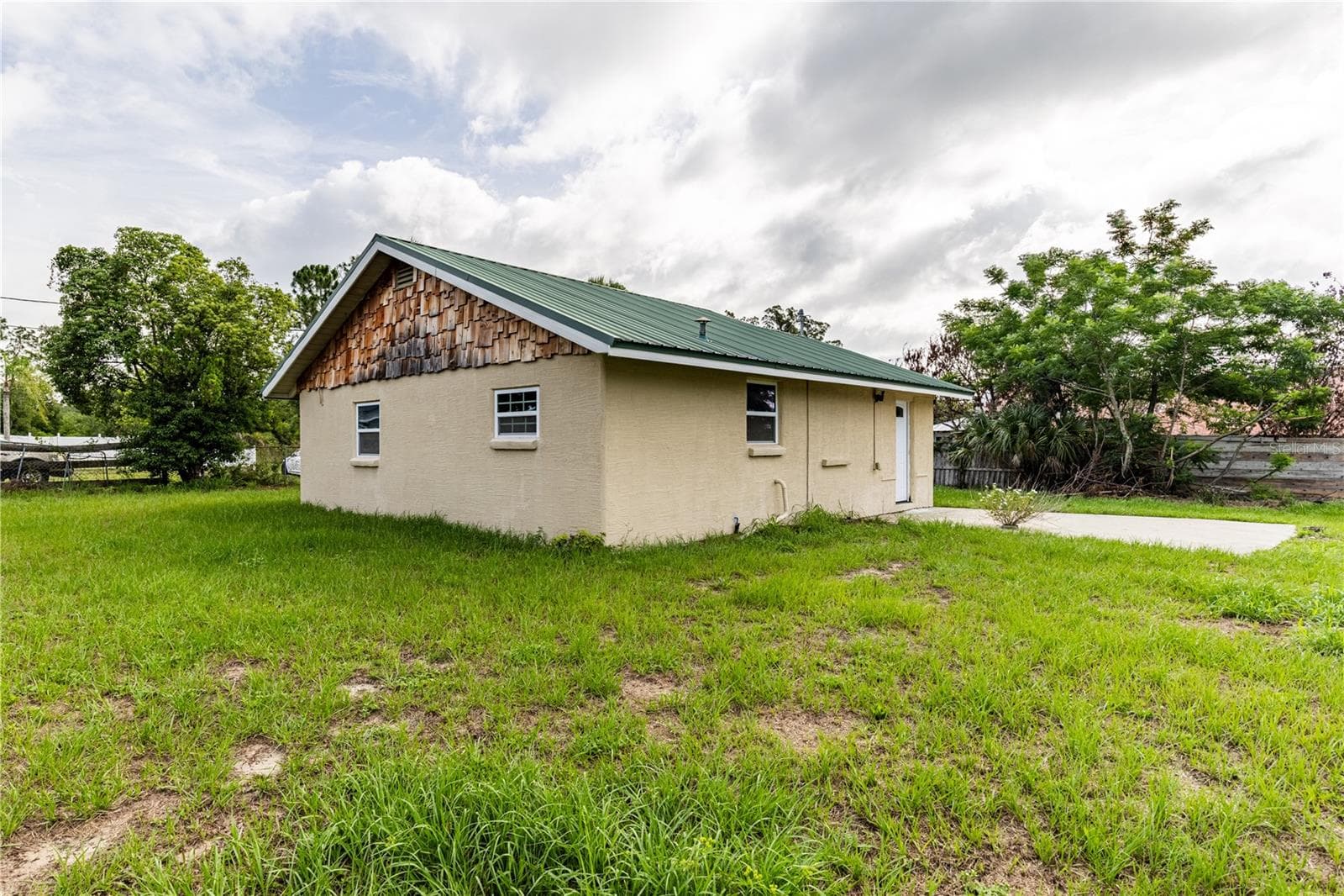 Side and rear view of home - 7020 SCOTT AVE, MOUNT DORA