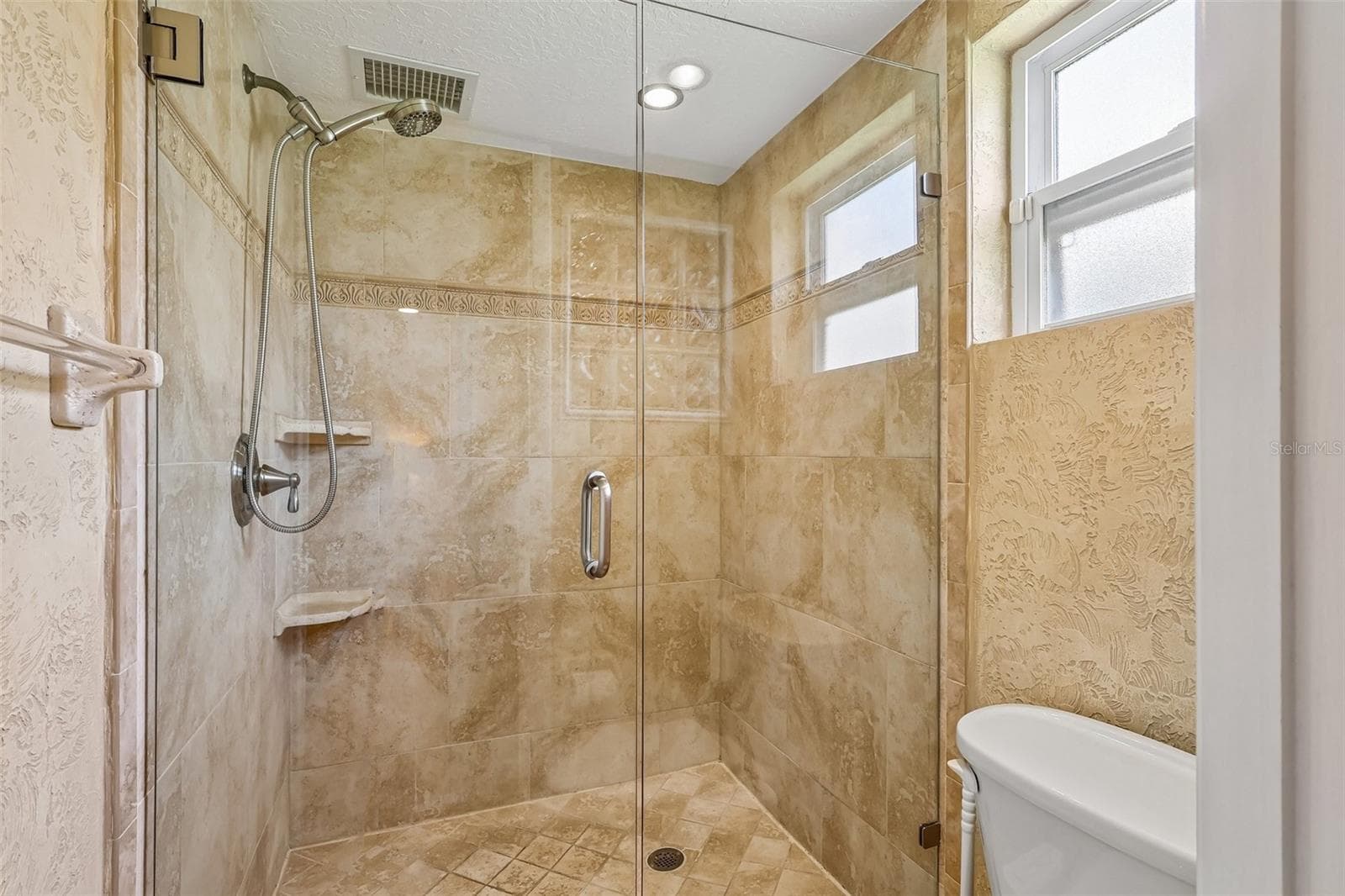 Relax at the end of your day in an EN SUITE BATH with dual sinks and a step-in shower. - 632 DESOTO DR #632, CASSELBERRY