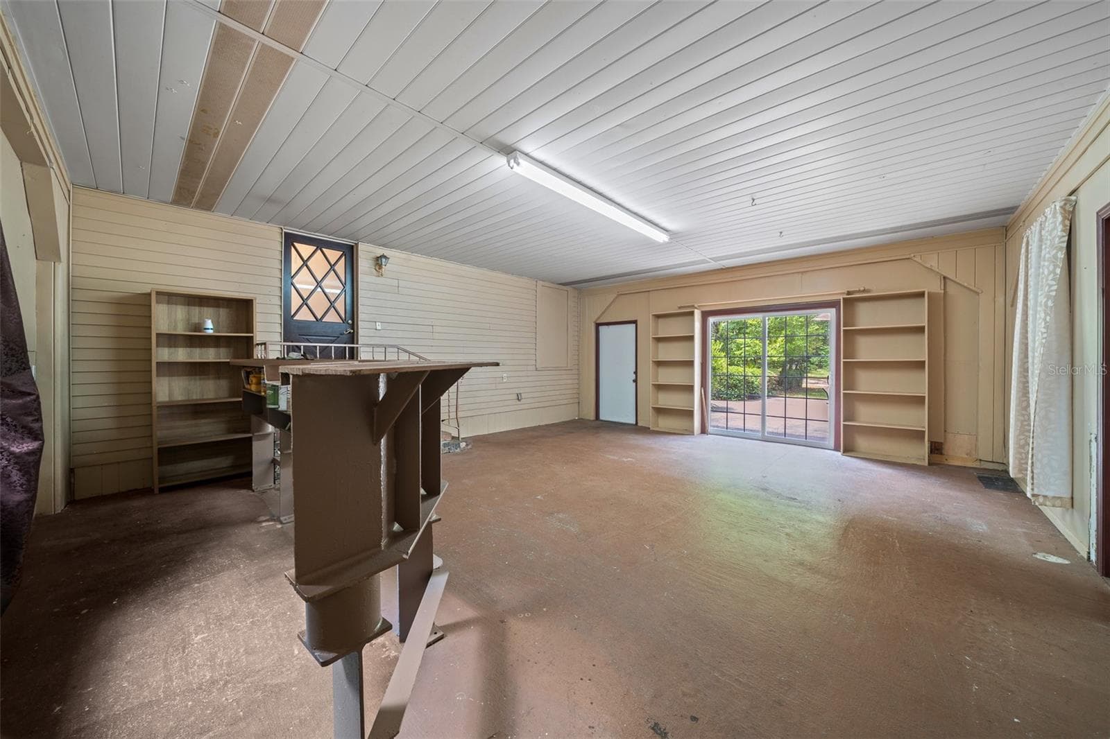 Game Room with French Doors and I-Beam Bar - 1985 NE 97TH STREED RD, ANTHONY