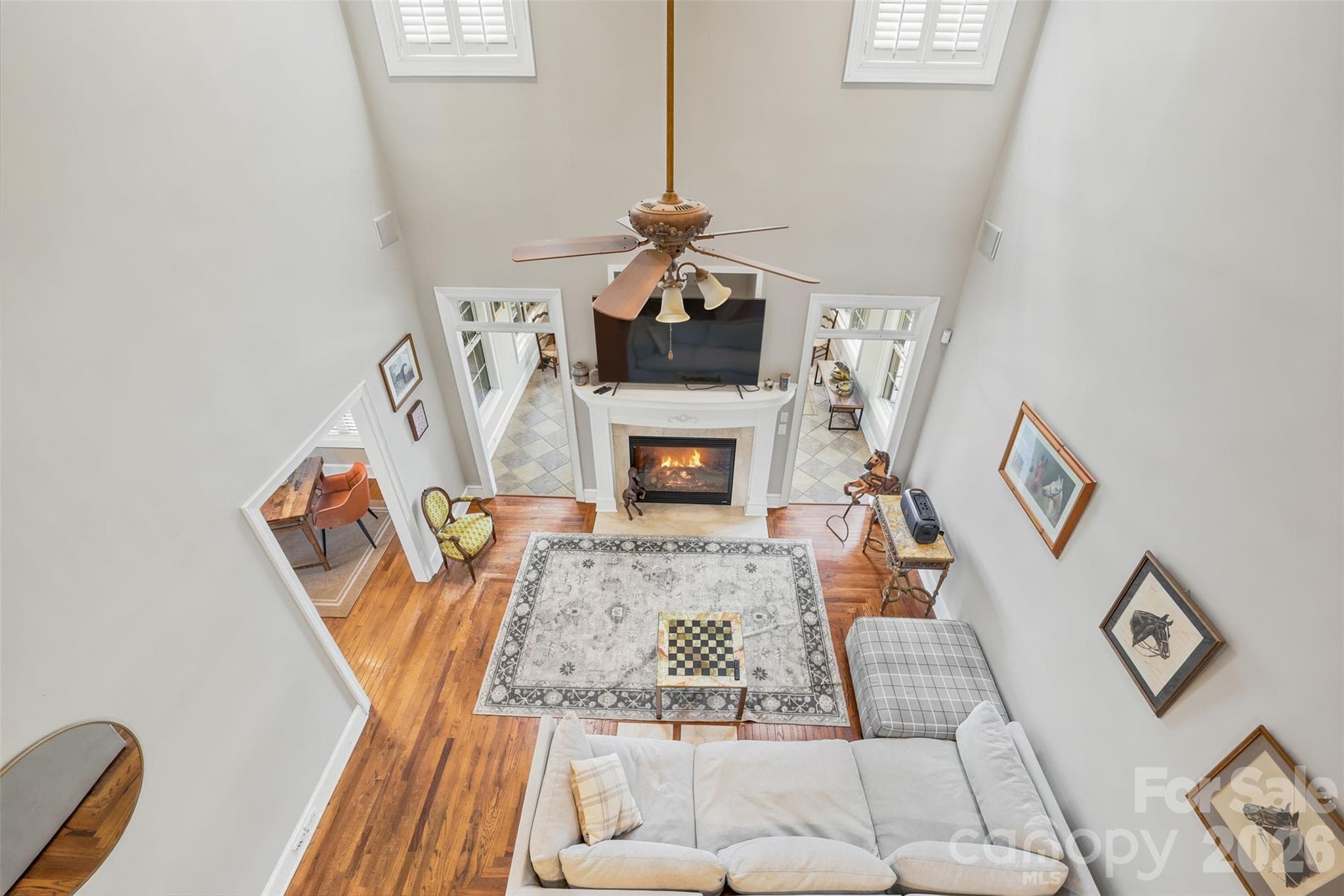 Soaring ceilings and abundant natural light create a dramatic and welcoming first impression. - 8520 Stock Horse Trail, Windsor