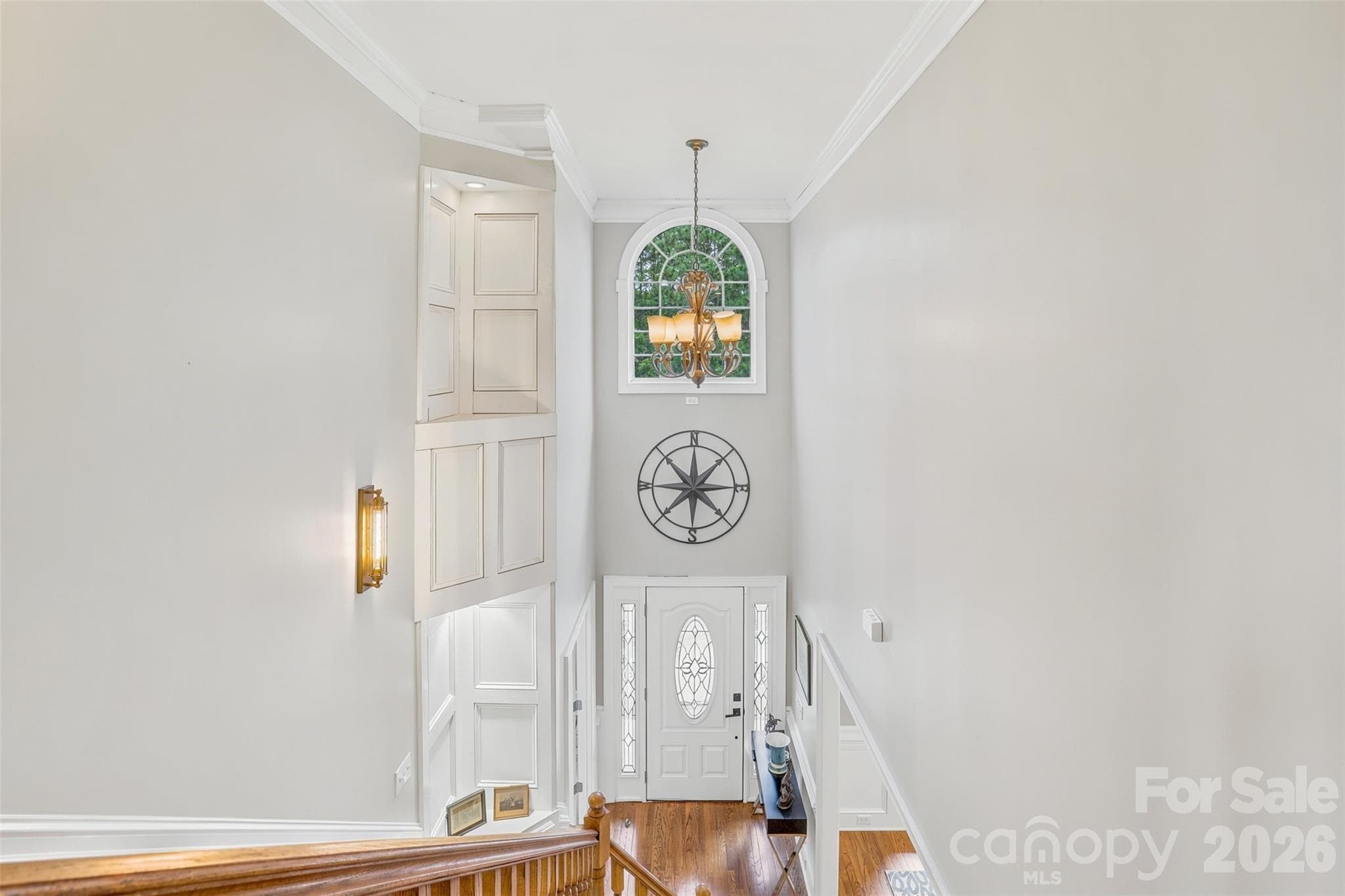 Elegant entryway welcomes guests with abundant natural light and timeless architectural details. - 8520 Stock Horse Trail, Windsor