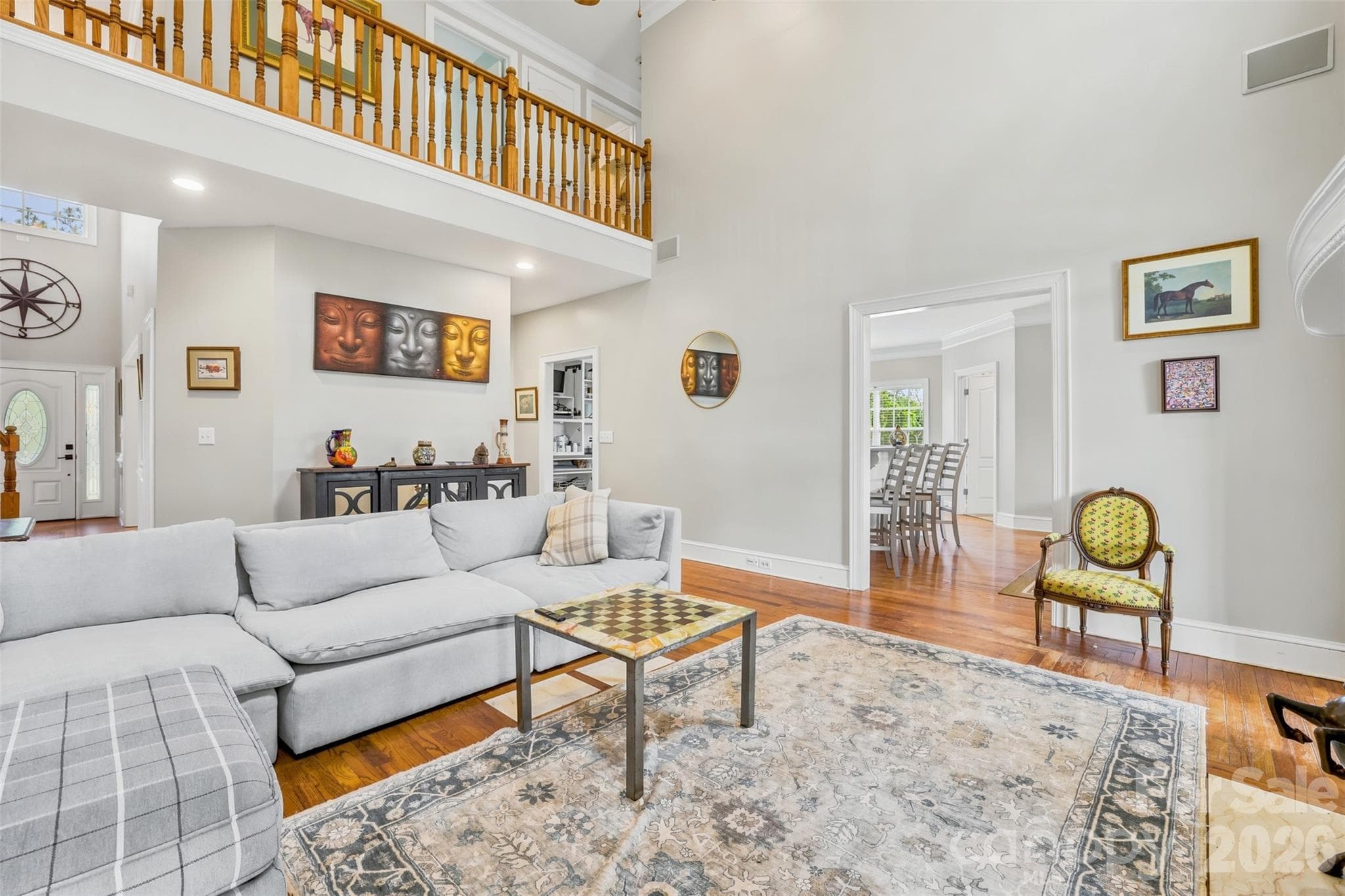 Bright and inviting living space offers seamless flow and exceptional views throughout the home. - 8520 Stock Horse Trail, Windsor