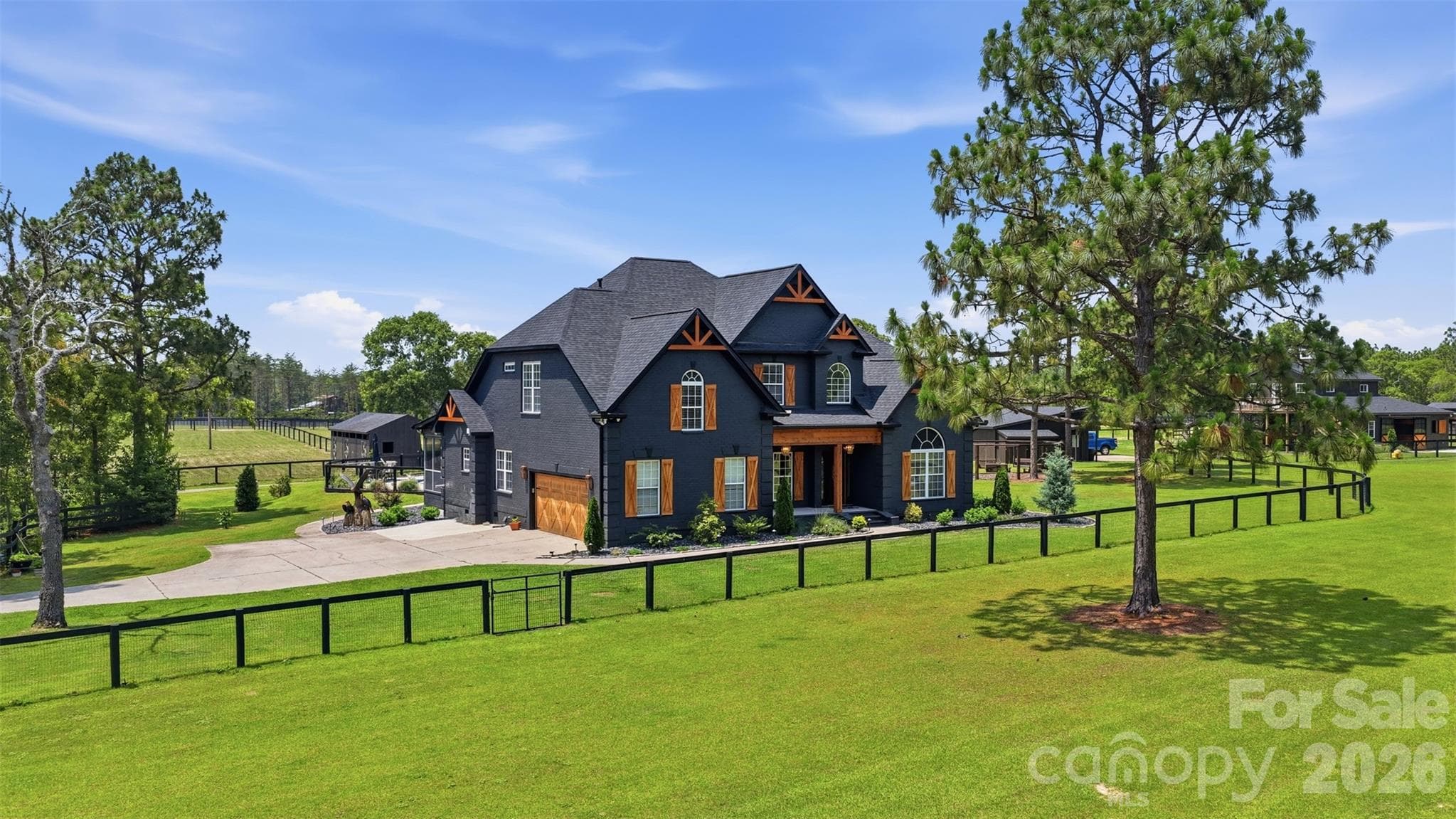 Stunning custom home overlooking manicured grounds and thoughtfully designed horse amenities - 8520 Stock Horse Trail, Windsor