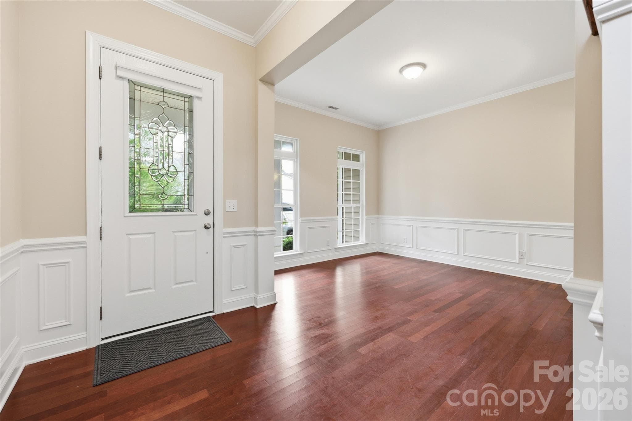 foyer looking into dining room on main level - 878 Treasure Court, Fort Mill