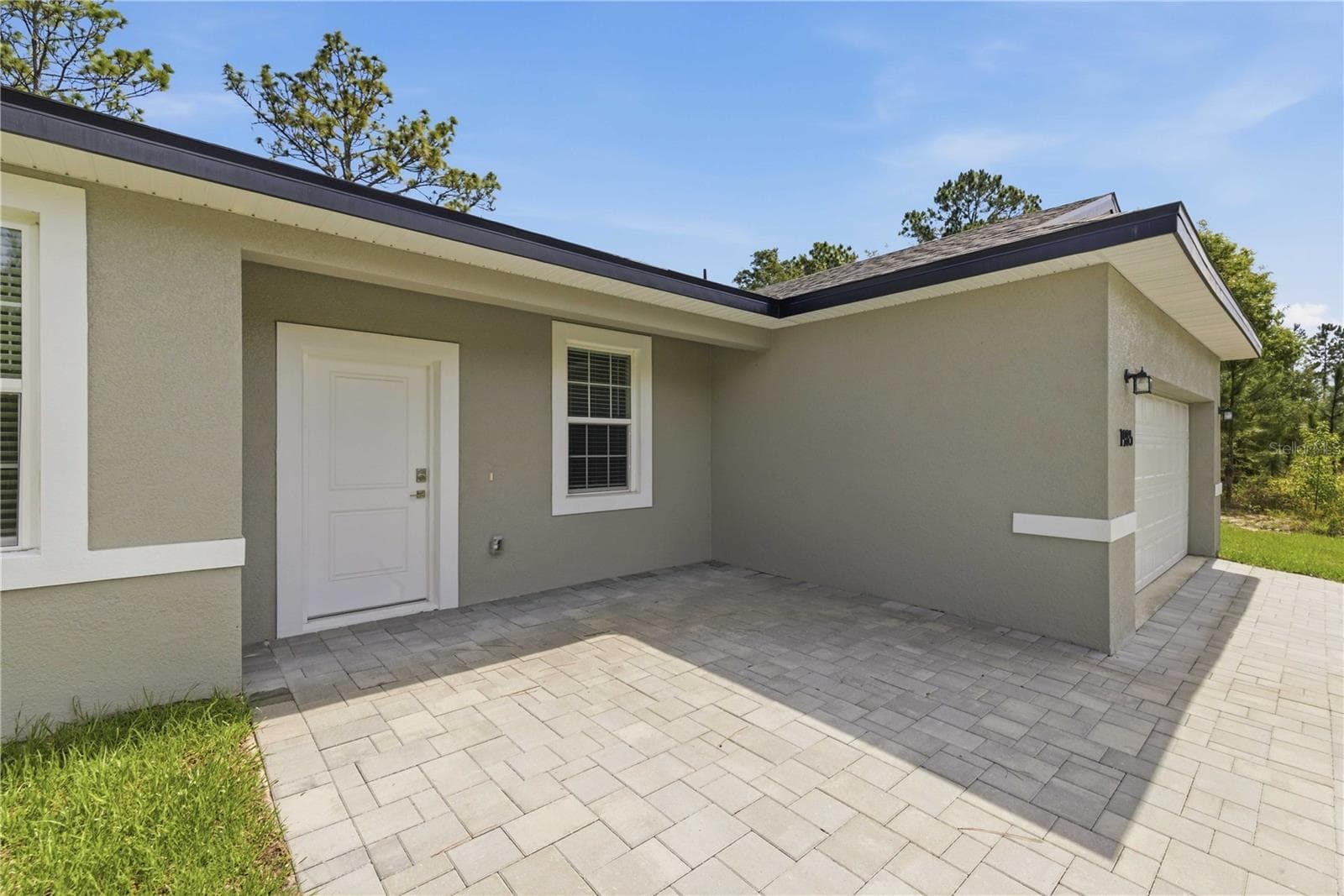 FRONT COVERED PAVER PORCH - 1985 W CORRINE ST, DUNNELLON