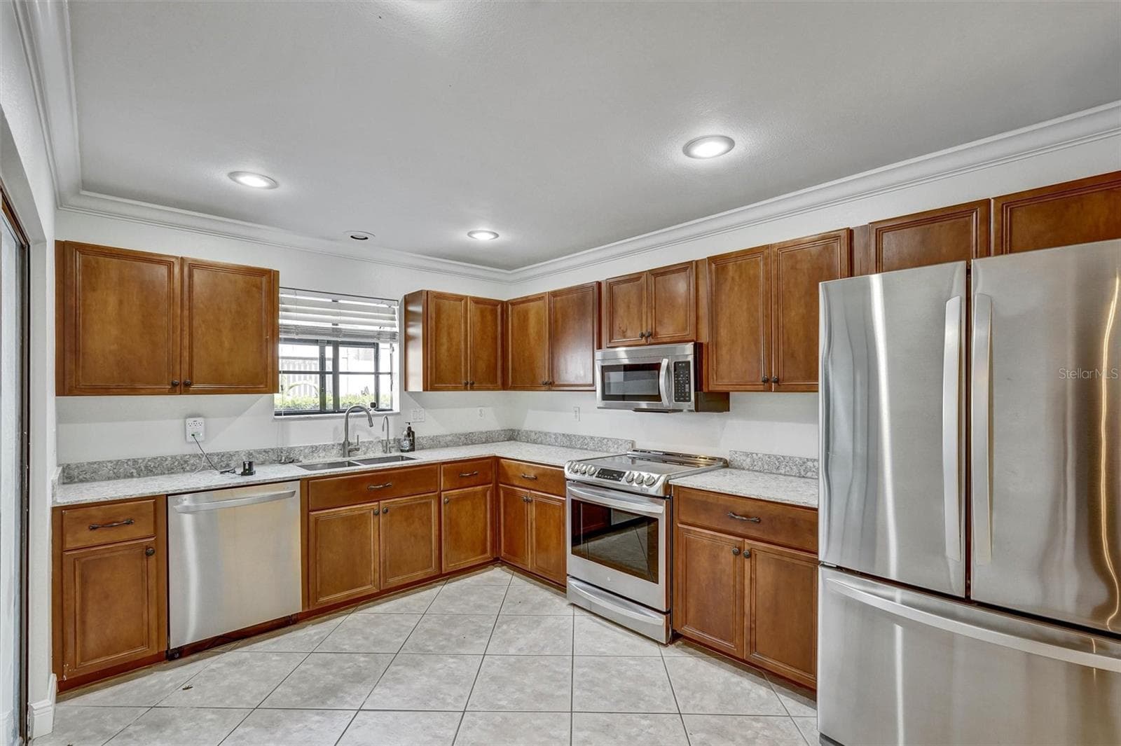 Kitchen, stainless steel appliances - 7861 PINE TRACE DR #7861, SARASOTA