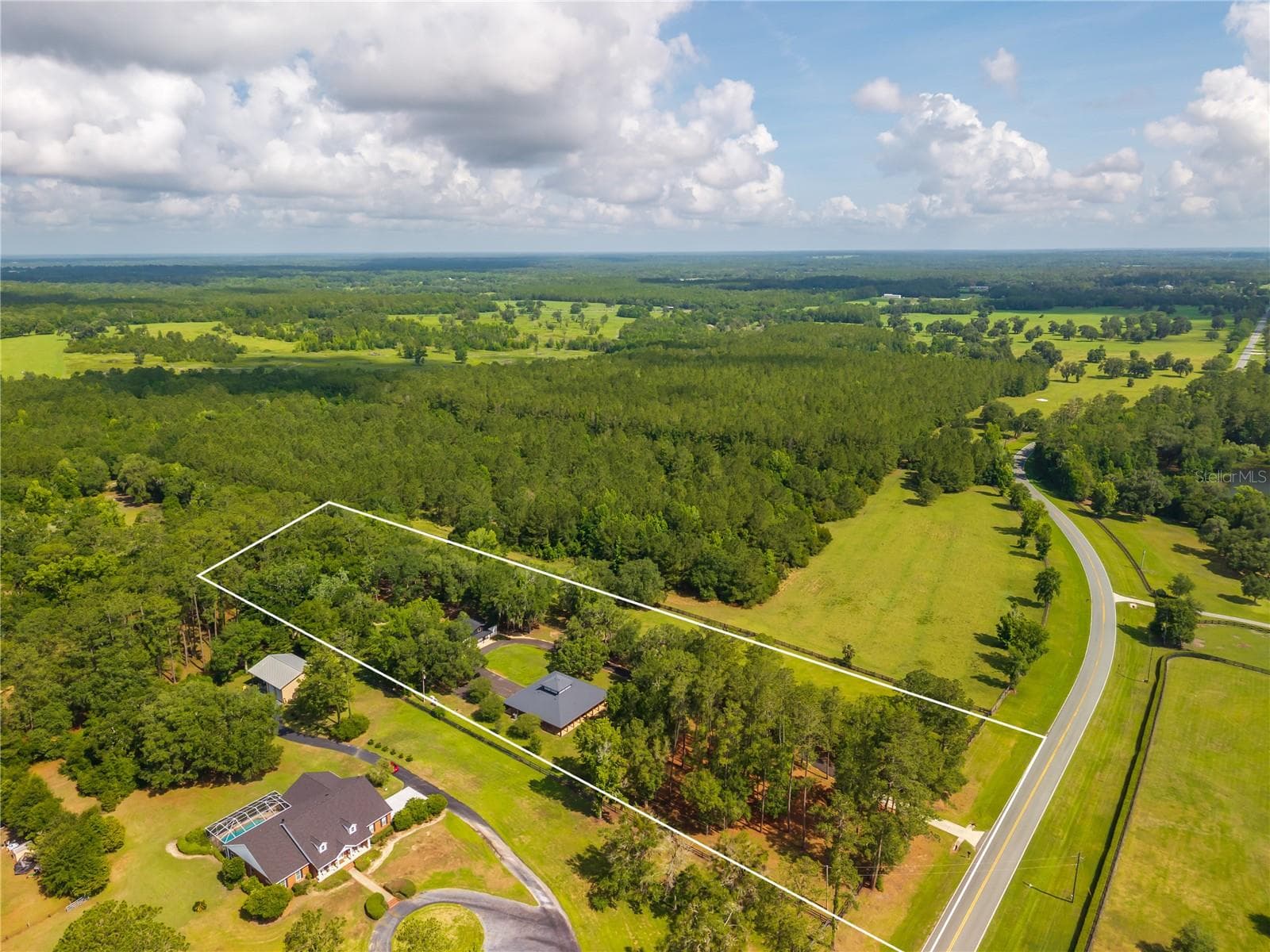 Nestled in the middle of hundred of acres properties - 6450 NW HIGHWAY 225, OCALA