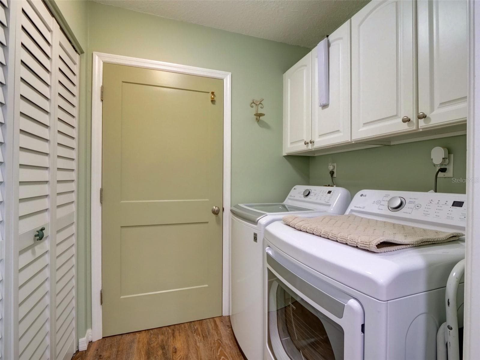 Laundry Room: Entry to the Garage - 100 S TREMAIN ST #G2, MOUNT DORA
