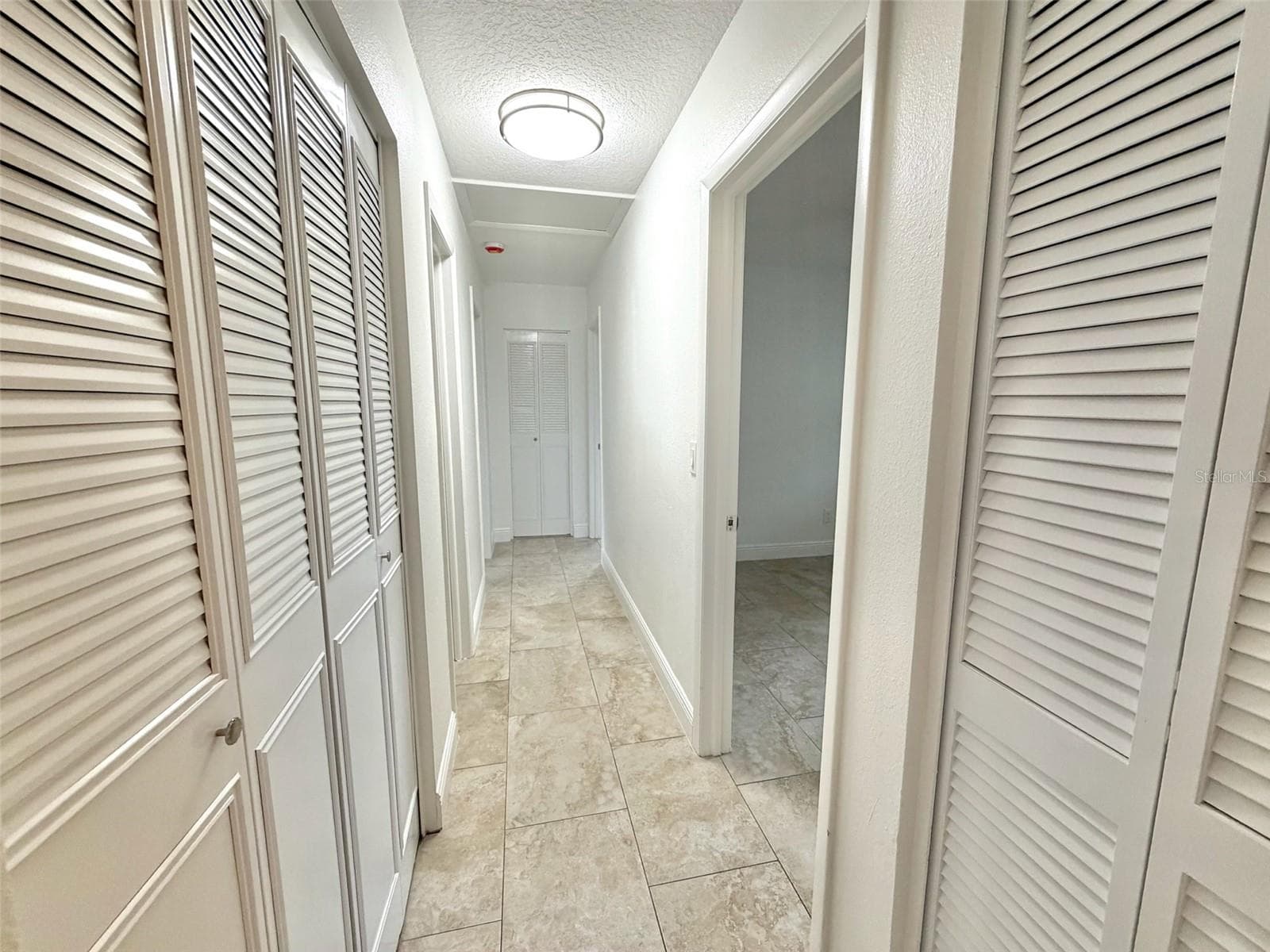 Storage Closets in hallway - 6945 ORKNEY AVE N, ST PETERSBURG