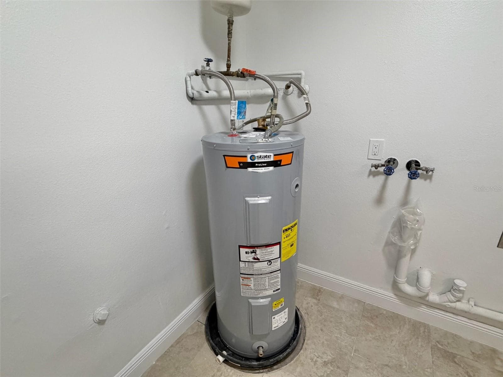 Laundry Room w/ water heater - 6945 ORKNEY AVE N, ST PETERSBURG
