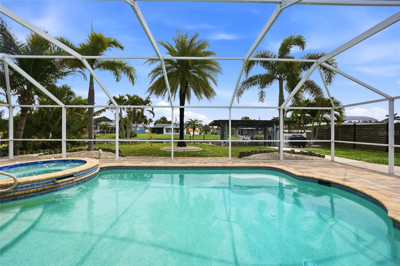 heated pool & spa overlooking the deep water canal - 1433 LEMON BAY DR, ENGLEWOOD