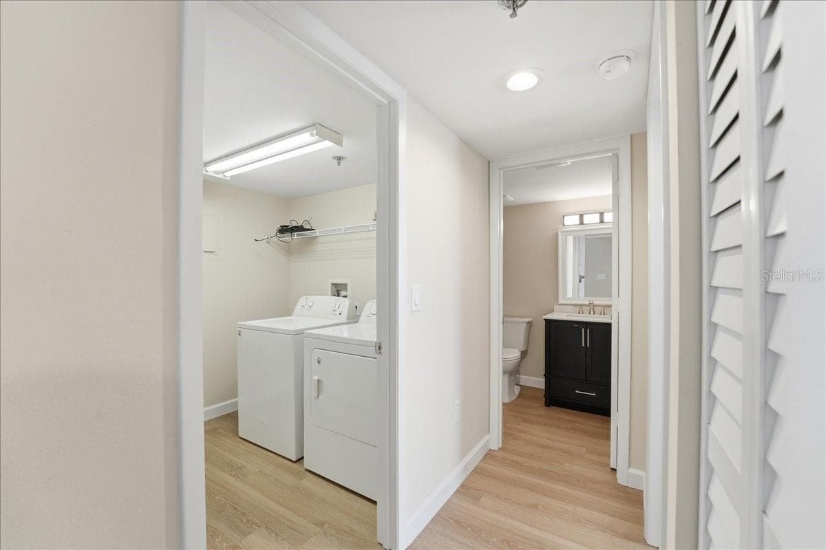 Hall to laundry room and the second bedroom - 4550 PINEBROOK CIR #506, BRADENTON
