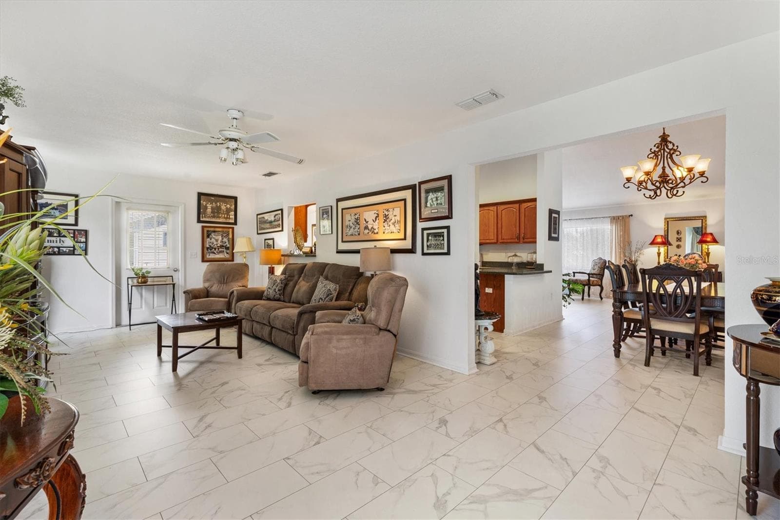 Florida room looking toward dining room and kitchen - 9498 SE 174TH LOOP, SUMMERFIELD
