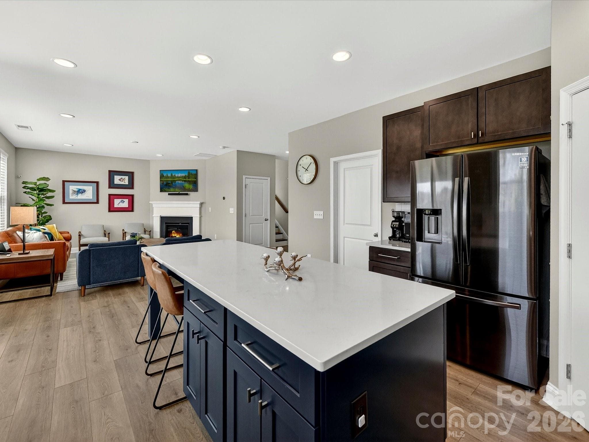 Island with Storage and Quartz Counters. Kitchen Refrigerator to Remain - 6203 Six String Court, Fort Mill