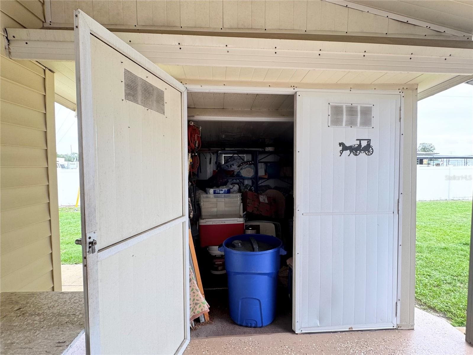 Shed at rear of carport - 35224 DODIE DR #Lot 12, ZEPHYRHILLS