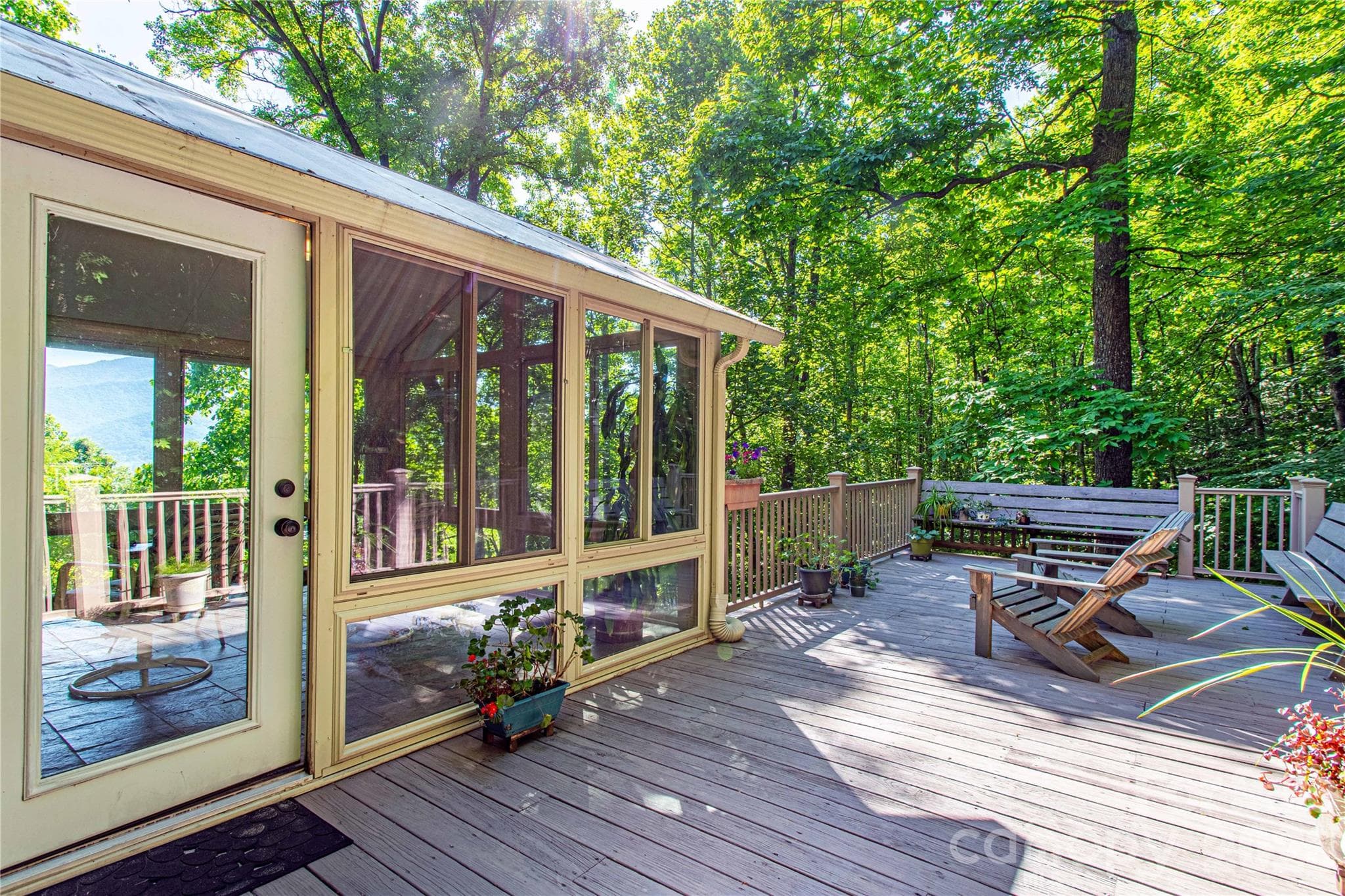 Another look at the large entertainment deck looking into the sunroom and year-round mountain view. - 22 Great Aspen Way, Black Mountain