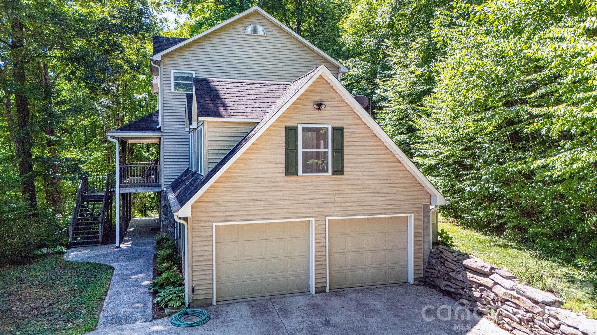 Another look of this beautiful mountain house with gentle, generous driveway. Note the 2-car garage, which also has space for a work bench and tools. - 22 Great Aspen Way, Black Mountain