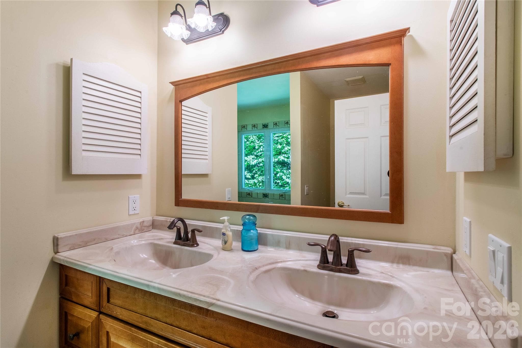 Twin vanities in the primary bath. - 22 Great Aspen Way, Black Mountain