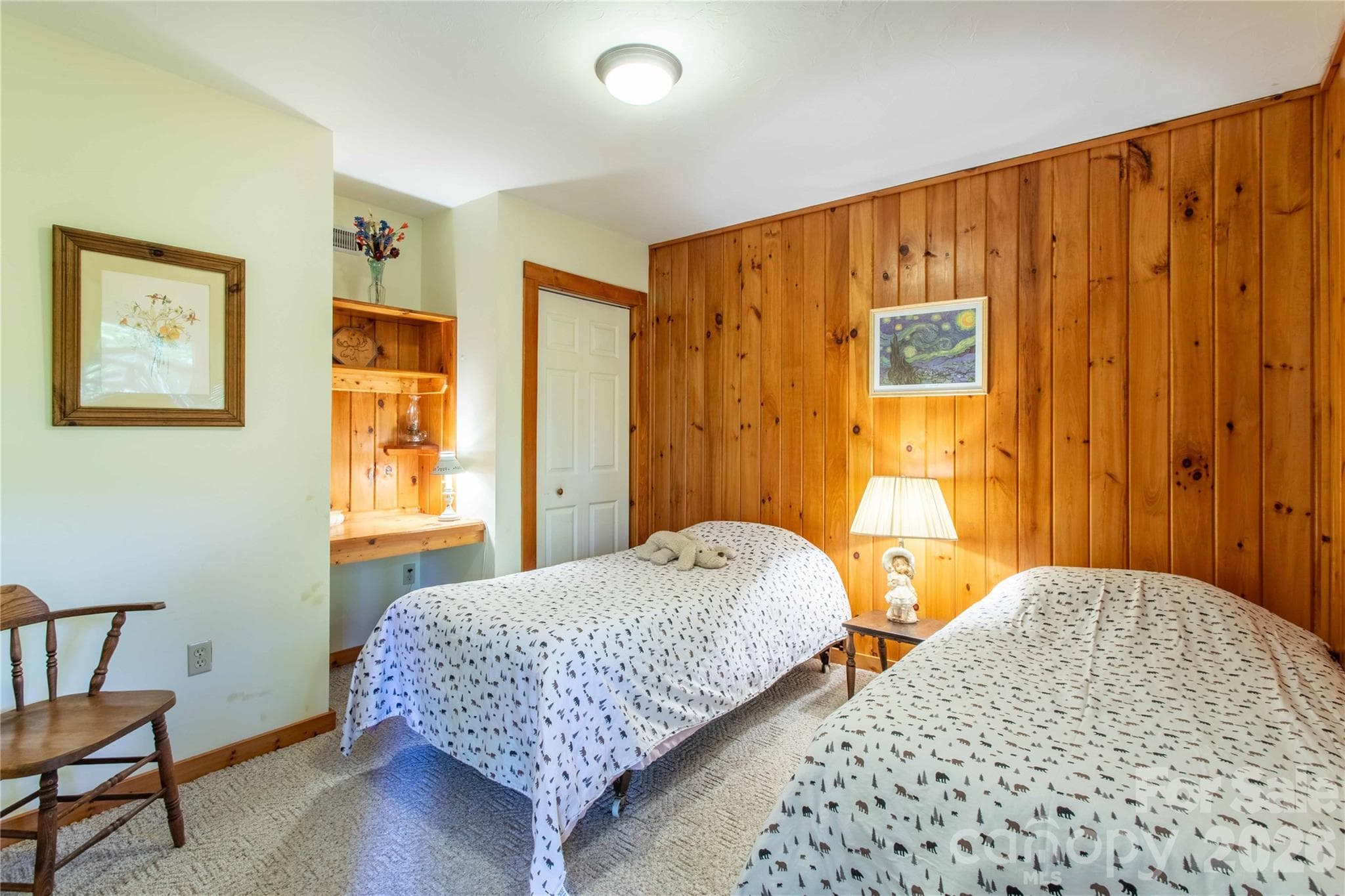 Downstairs bedroom with closet and built-in desk offers plenty of room for guests or tenants. - 22 Great Aspen Way, Black Mountain