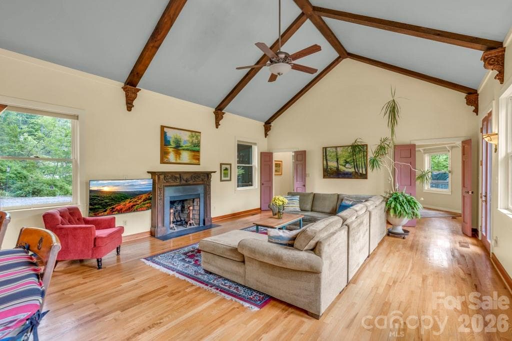 Main-level great room with vaulted ceilings and a 'treehouse' feel out the windows! - 1590 Shulls Mill Road, Boone