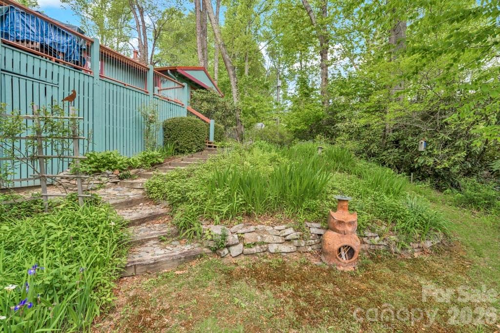 Summer view: usable yards, large rock outcroppings, perennial gardens - 1590 Shulls Mill Road, Boone