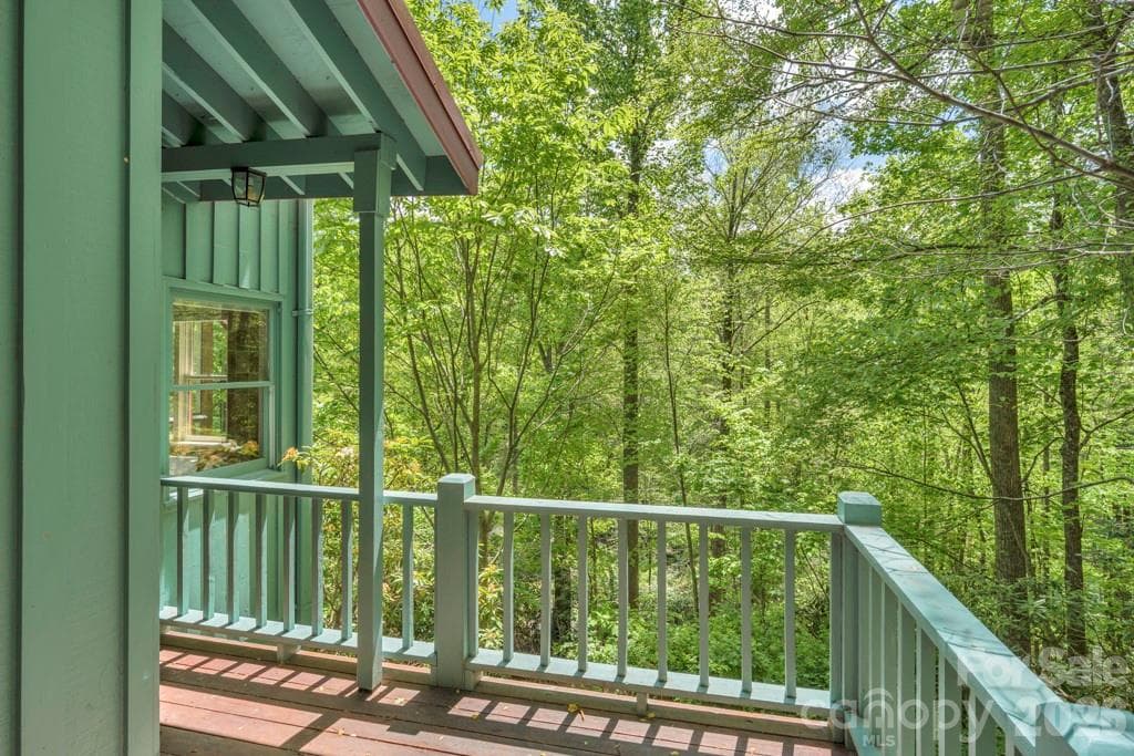 Deck off lower-level studio bedroom suite bath, summer view - 1590 Shulls Mill Road, Boone