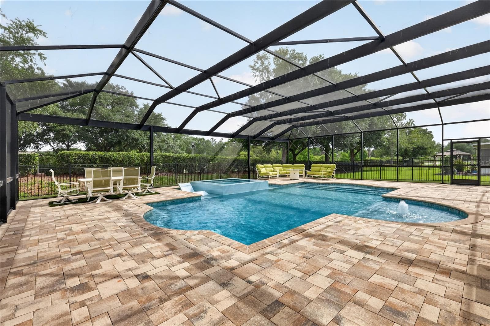 Huge paver pool deck 48' x 55' with dining and seating areas ~ - 5006 RISHLEY RUN WAY, MOUNT DORA