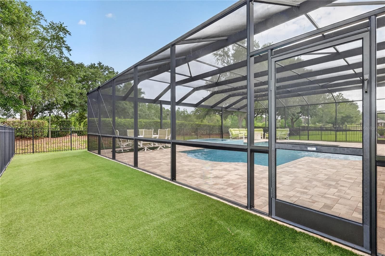 Pool enclosure has doors on each side to access the play areas ~ - 5006 RISHLEY RUN WAY, MOUNT DORA