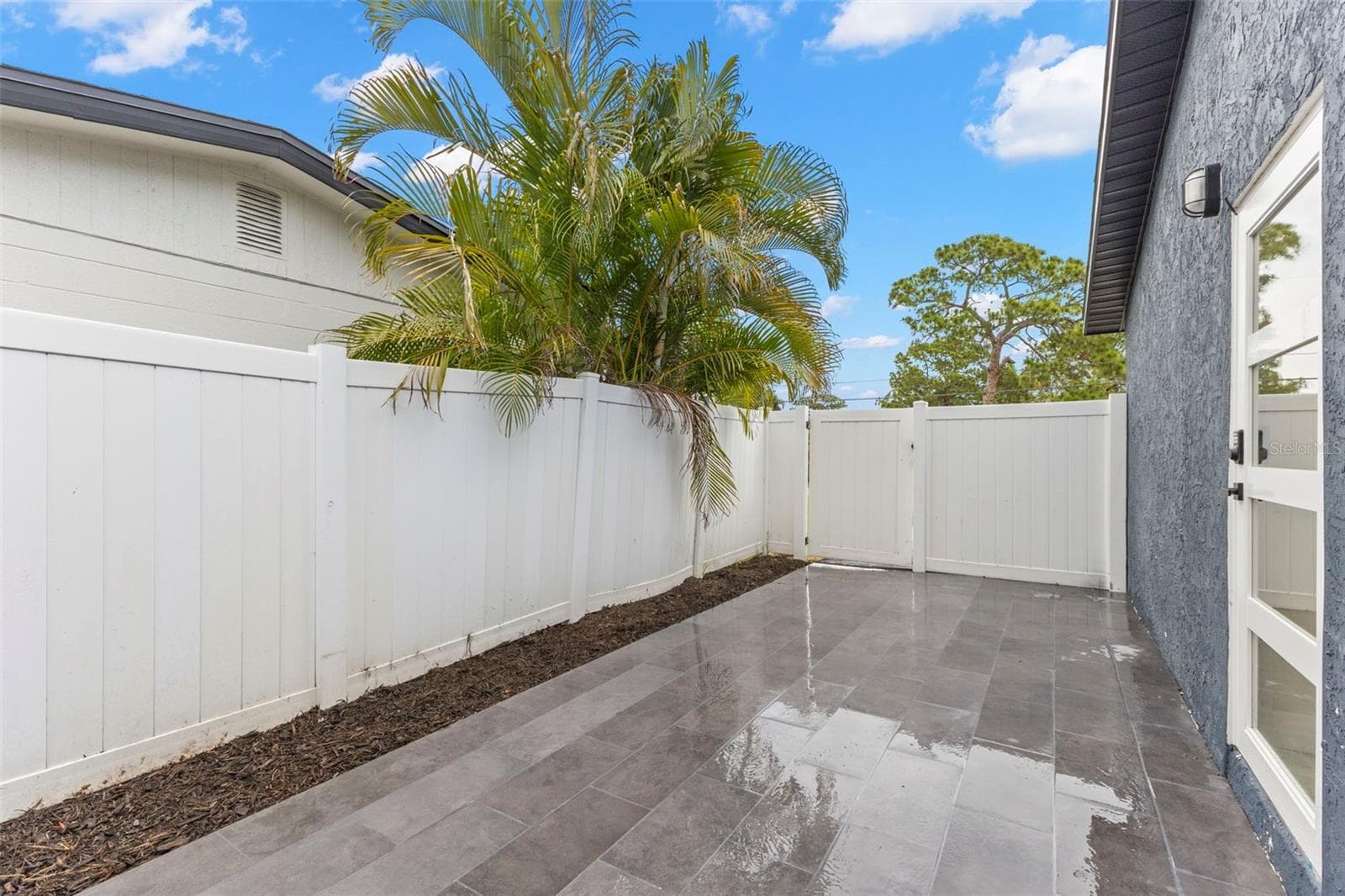Extended patio off primary suite - 4430 CARSON ST NE, ST PETERSBURG